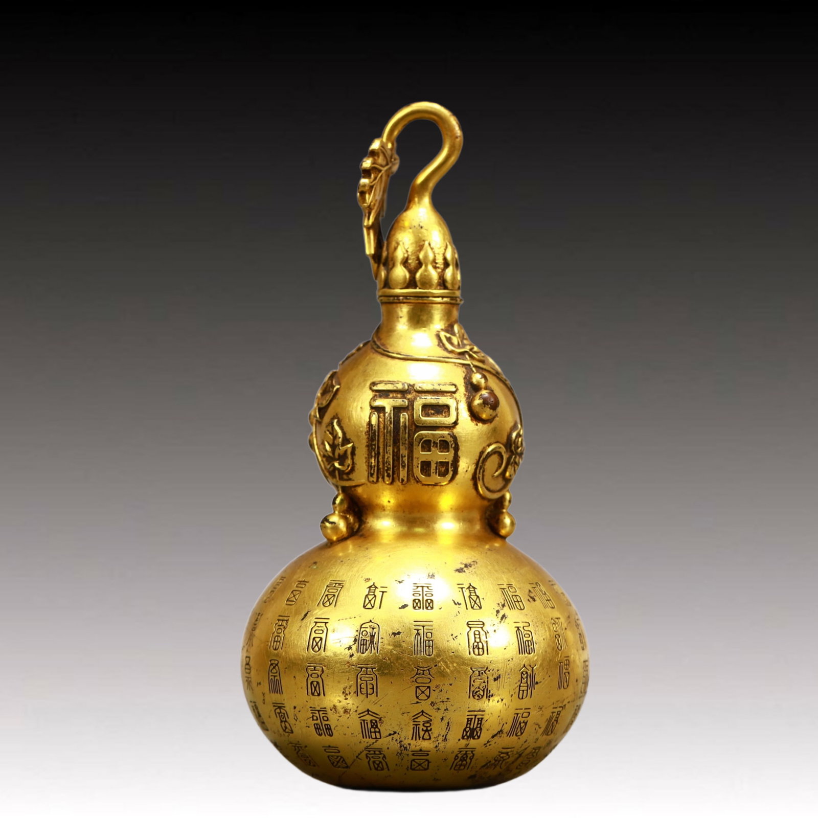 A Rare Gilt Bronze Fu-Character Pattern Gourd-Shaped Vase: A Rare Gilt Bronze Fu-Character Pattern Gourd-Shaped Vase,Qing Dynasty, China,Size:6.3inx3in,Weight:700g 铜鎏金福字纹葫芦瓶,中国଀