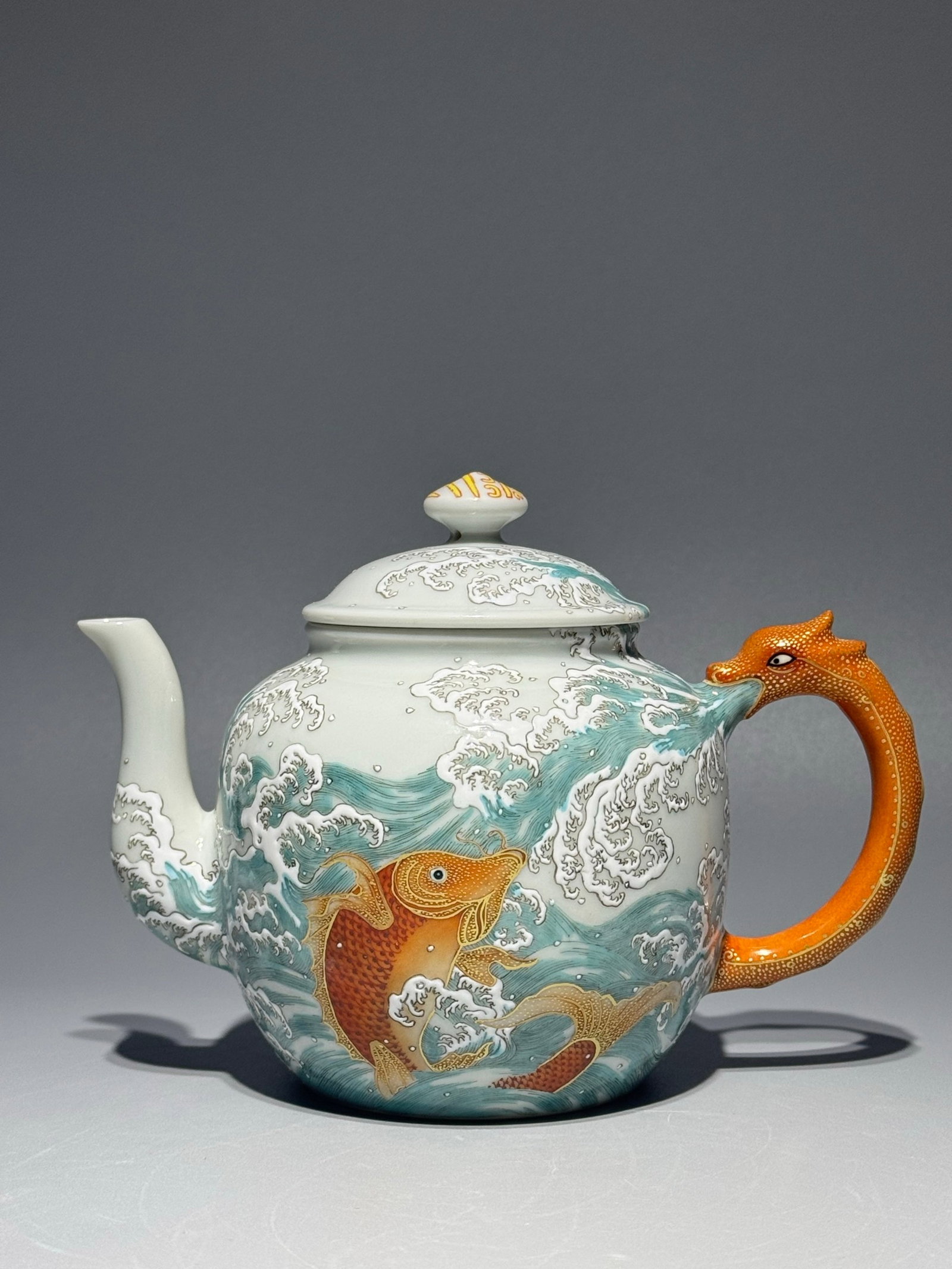 An Exquisite Famille-Rose Seawater and Fish Pattern Pot: An Exquisite Famille-Rose Seawater and Fish Pattern Pot,Qing Dynasty,China,Qianlong Six-character Mark,Size:5inx6.8in 粉彩海水鱼纹壶,中国清&