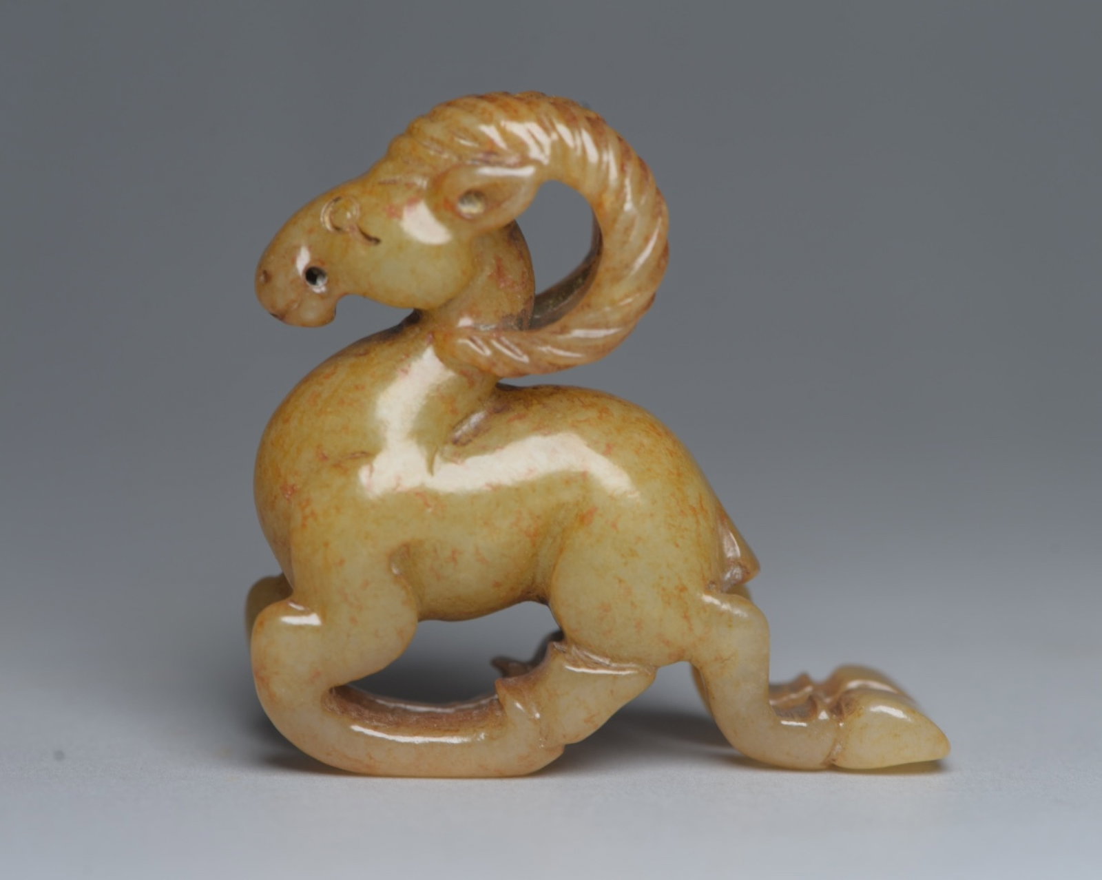 An Exquisite White Jade Sheep Ornament: An Exquisite White Jade Sheep Ornament,Qing Dynasty,China,Size:2inx2inx0.7in,Weight:43g 白玉羊摆件,中国清代