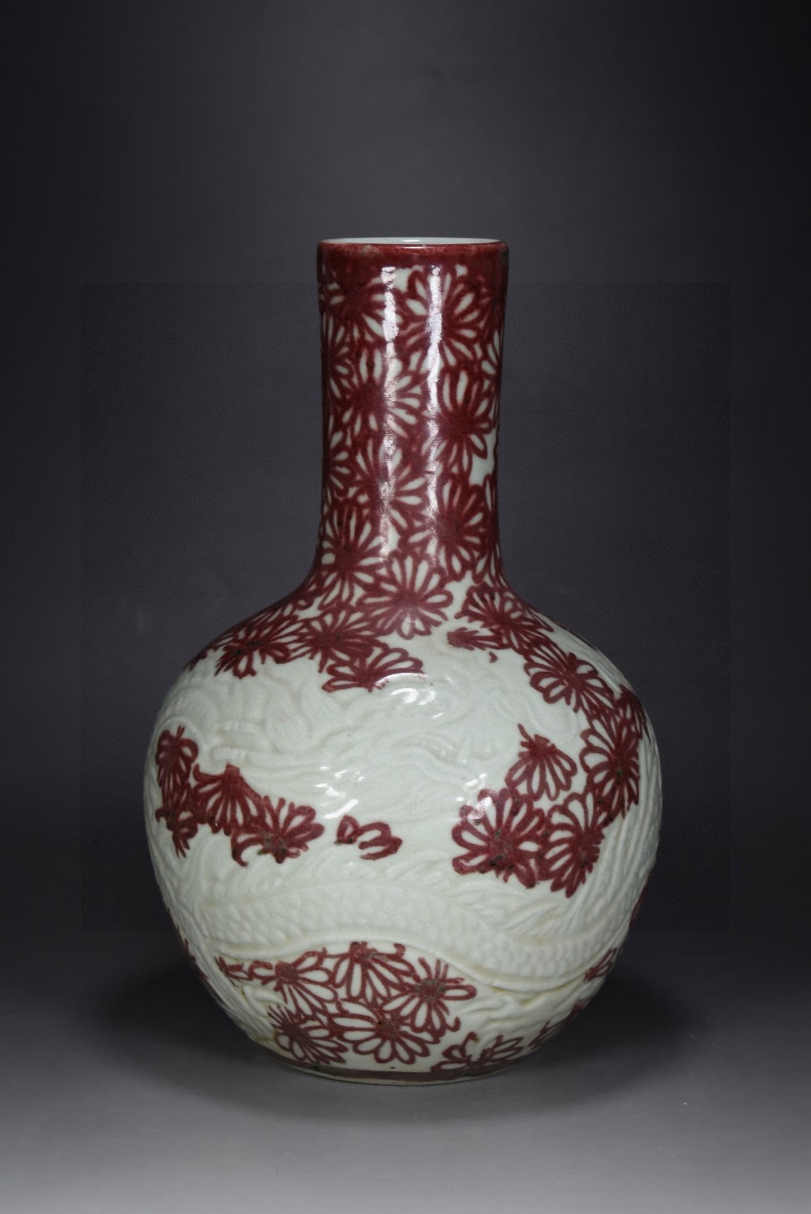 A Rare Underglaze-Red Flower Dragon Pattern Vase: A Rare Underglaze-Red Flower Dragon Pattern Vase,Qing Dynasty,China,Size:13.8inx8.7in 釉里红花卉龙纹瓶,中国清代