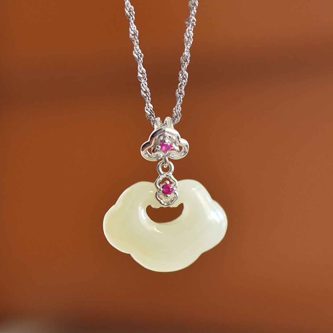 An Exquisite Sterling Silver-Gold Plated Inlaid White Jade Pendant: An Exquisite Sterling Silver-Gold Plated Inlaid White Jade Pendant,Size:0.6inx0.8in 纯银镀金镶白玉吊坠