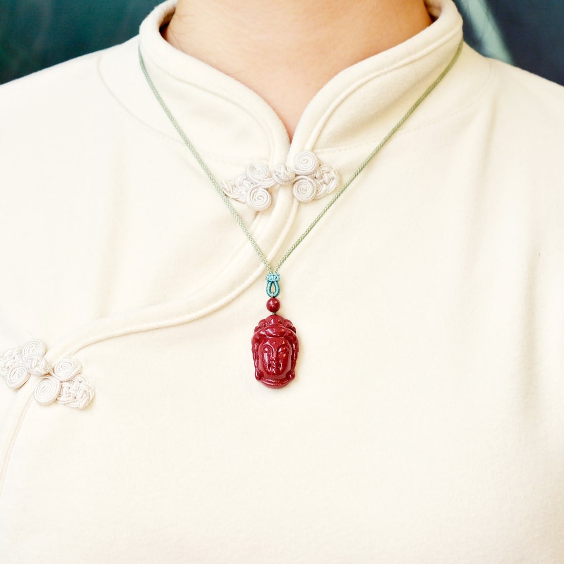 An Exquisite Cinnabar Pendant with Statue of Avalokitesvara Head: An Exquisite Cinnabar Pendant with Statue of Avalokitesvara Head,Size:0.8inx1.2in,Weight:11.7g 朱砂挂件带观音头像