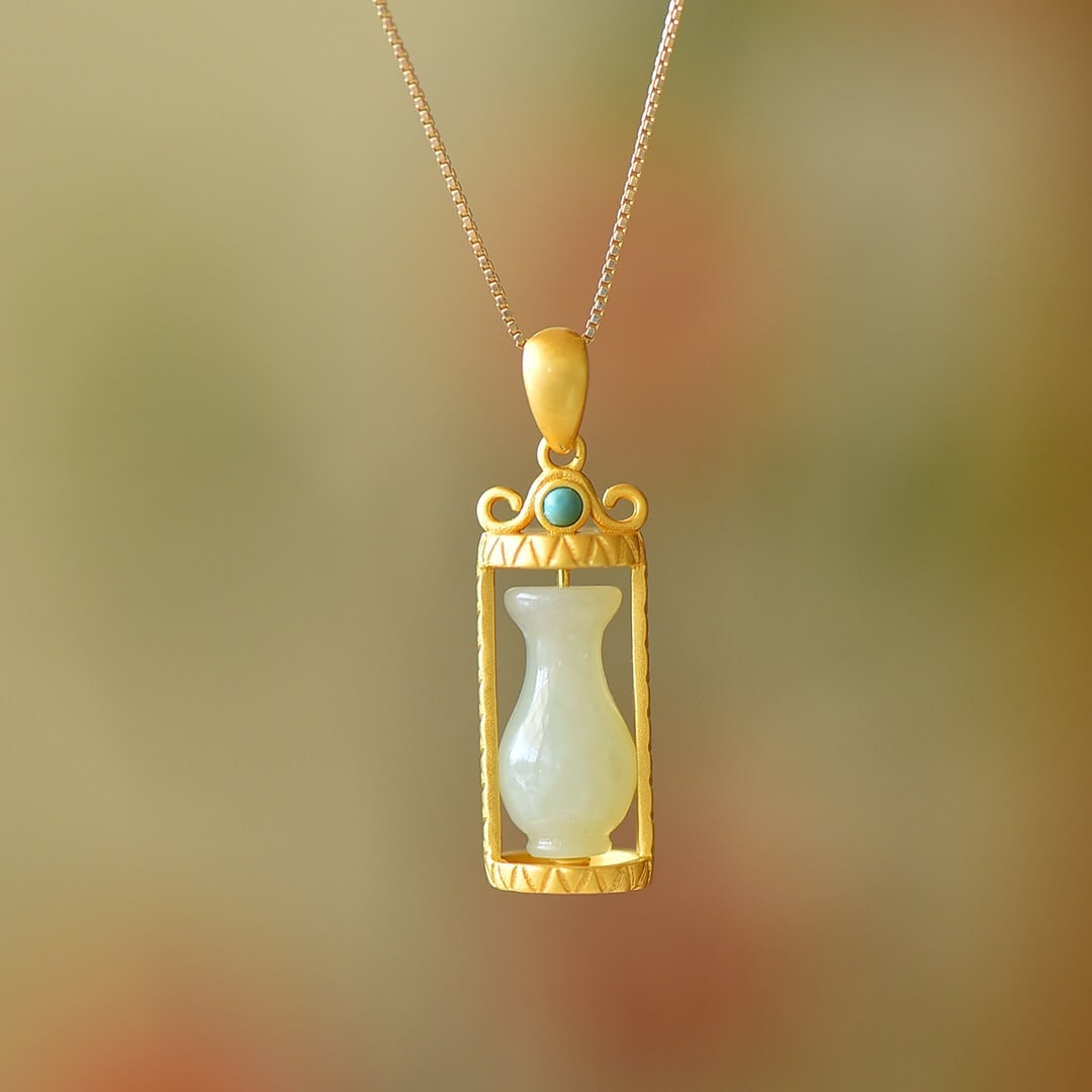 An Exquisite Sterling Silver-Gold Plated Inlaid White Jade Pendant: An Exquisite Sterling Silver-Gold Plated Inlaid White Jade Pendant,Size:0.3inx0.6in 纯银镀金镶白玉吊坠