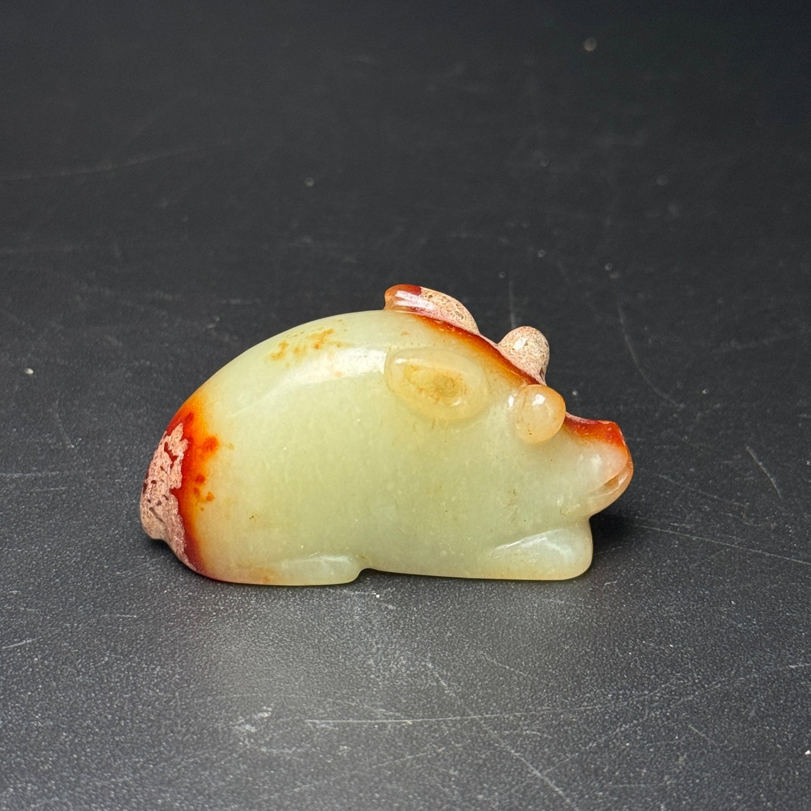 An Exquisite Archaic Jade Pig Ornament: An Exquisite Archaic Jade Pig Ornament,Ancient Time,China,Size:53mmx28mmx18mm,Weight:49g 高古玉猪摆件,中国远古时期