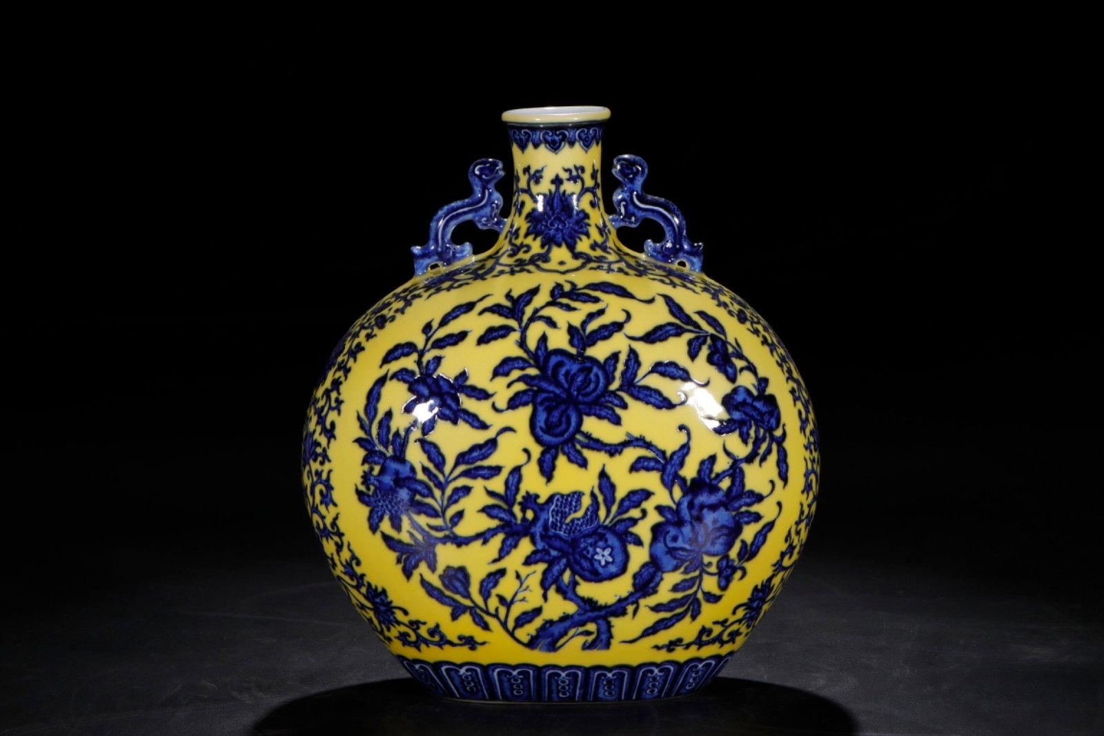 A Rare Yellow Ground Blue and White Flower and Fruit Pattern Double-Ears Vase: A Rare Yellow Ground Blue and White Flower and Fruit Pattern Double-Ears Vase,Qing Dynasty,China,Qianlong Six-character Mark,Size:11.5inx5.7in 黄地青花花果纹&