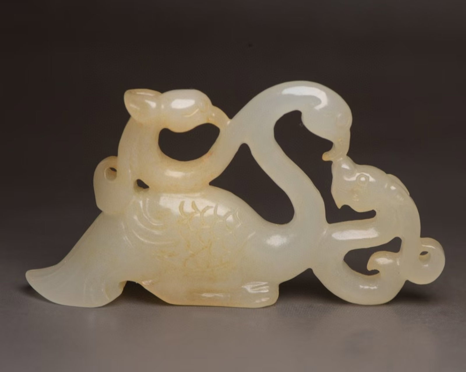 An Exquisite White Jade Dragon and Phoenix Pendant: An Exquisite White Jade Dragon and Phoenix Pendant,Qing Dynasty,China,Size:2.9inx1.5inx0.4in,Weight:32g 白玉龙凤佩,中国清代