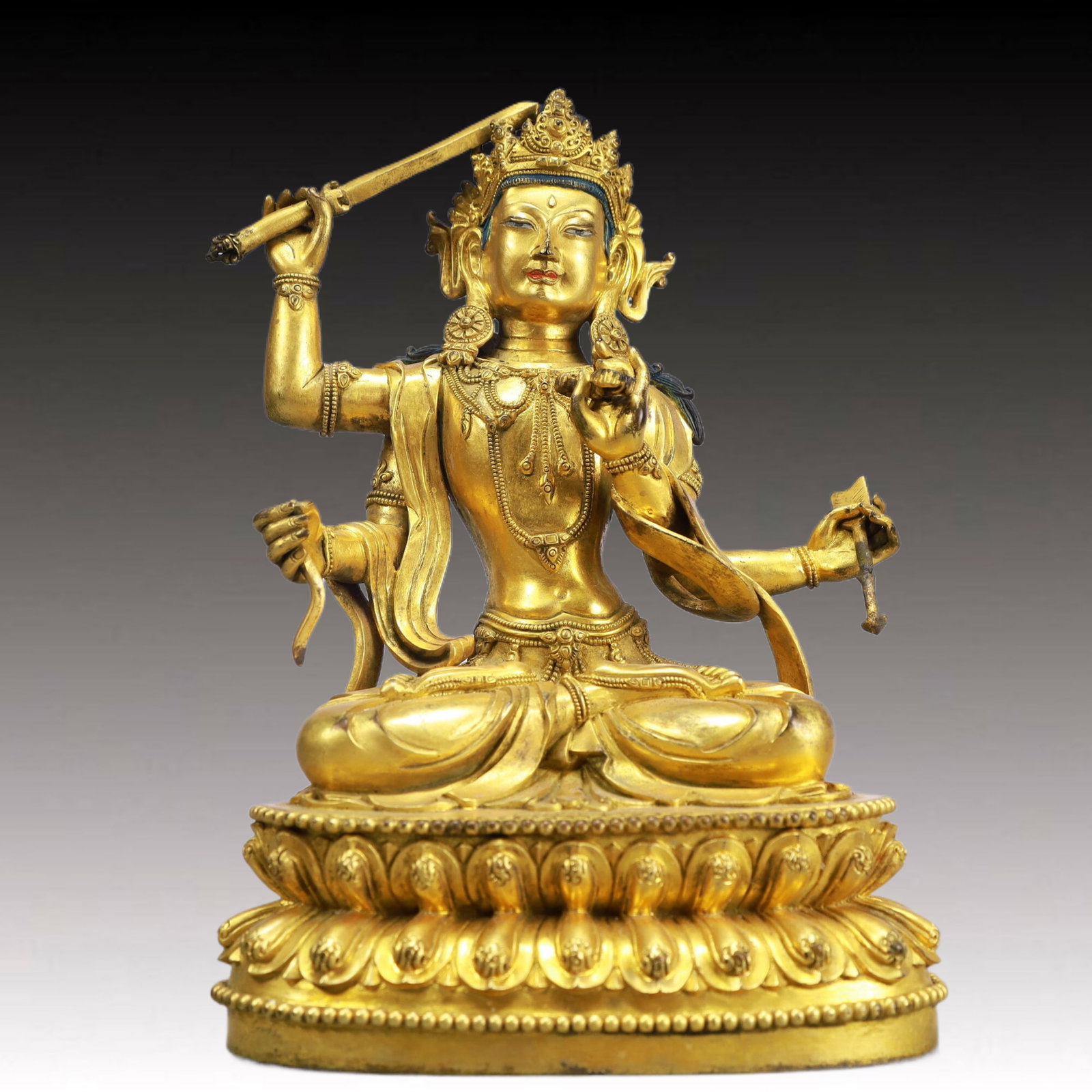 A Solemn Gilt Bronze Four-arms Statue of Manjusri: A Solemn Gilt Bronze Four-arms Statue of Manjusri,Ming Dynasty, China,Yongle Six-character Mark,Size:6.3inx4.3inx9.8in Weight:3050g 铜鎏金四臂文殊菩!
