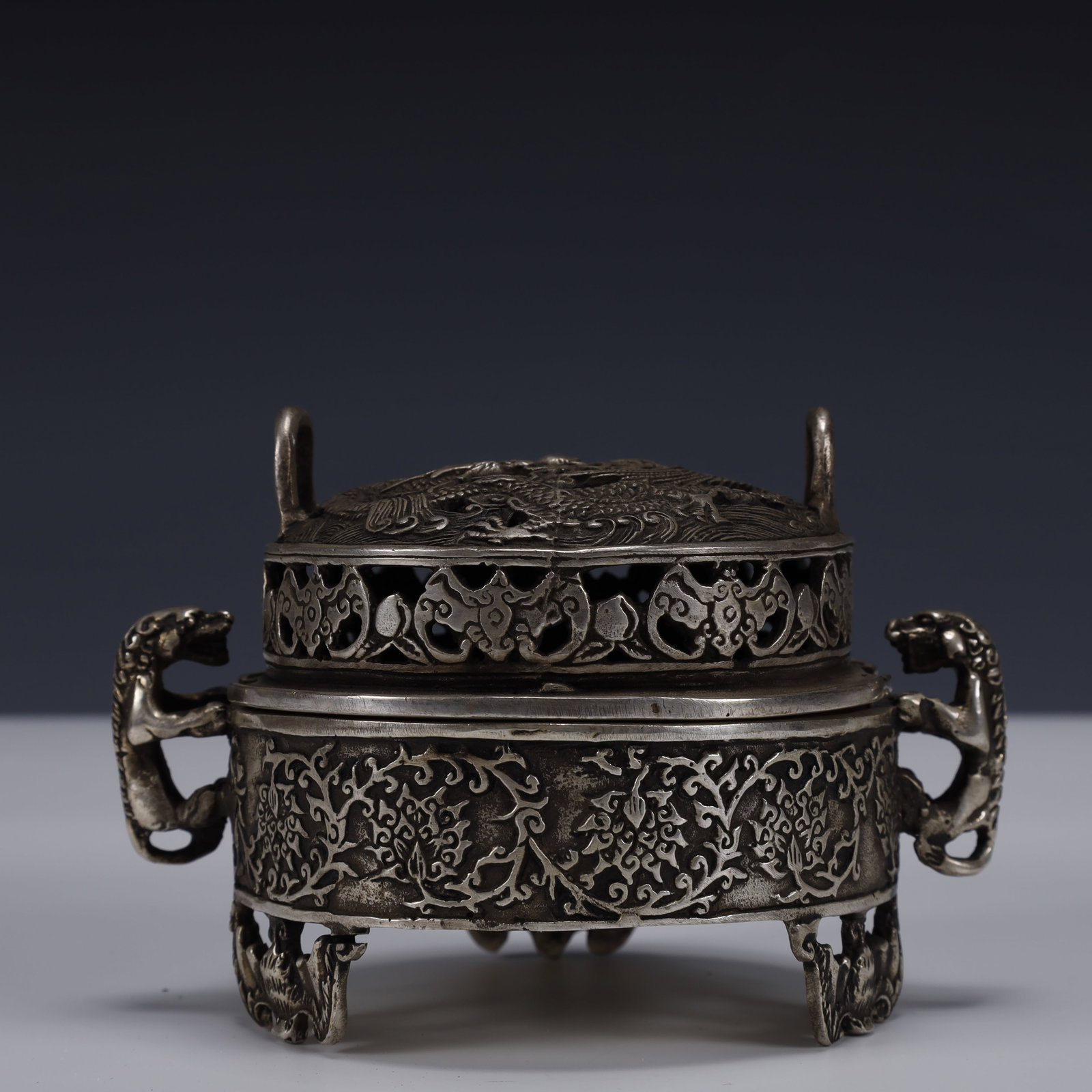 An Exquisite Silver-Plated Bronze Dragon and Phoenix Pattern Double-Ears and Tripod Censer: An Exquisite Silver-Plated Bronze Dragon and Phoenix Pattern Double-Ears and Tripod Censer ,Qing Dynasty, China,With Mark,Size:5.9inx4.3inx3.5in,Weight:550g 铜镀银龙凤