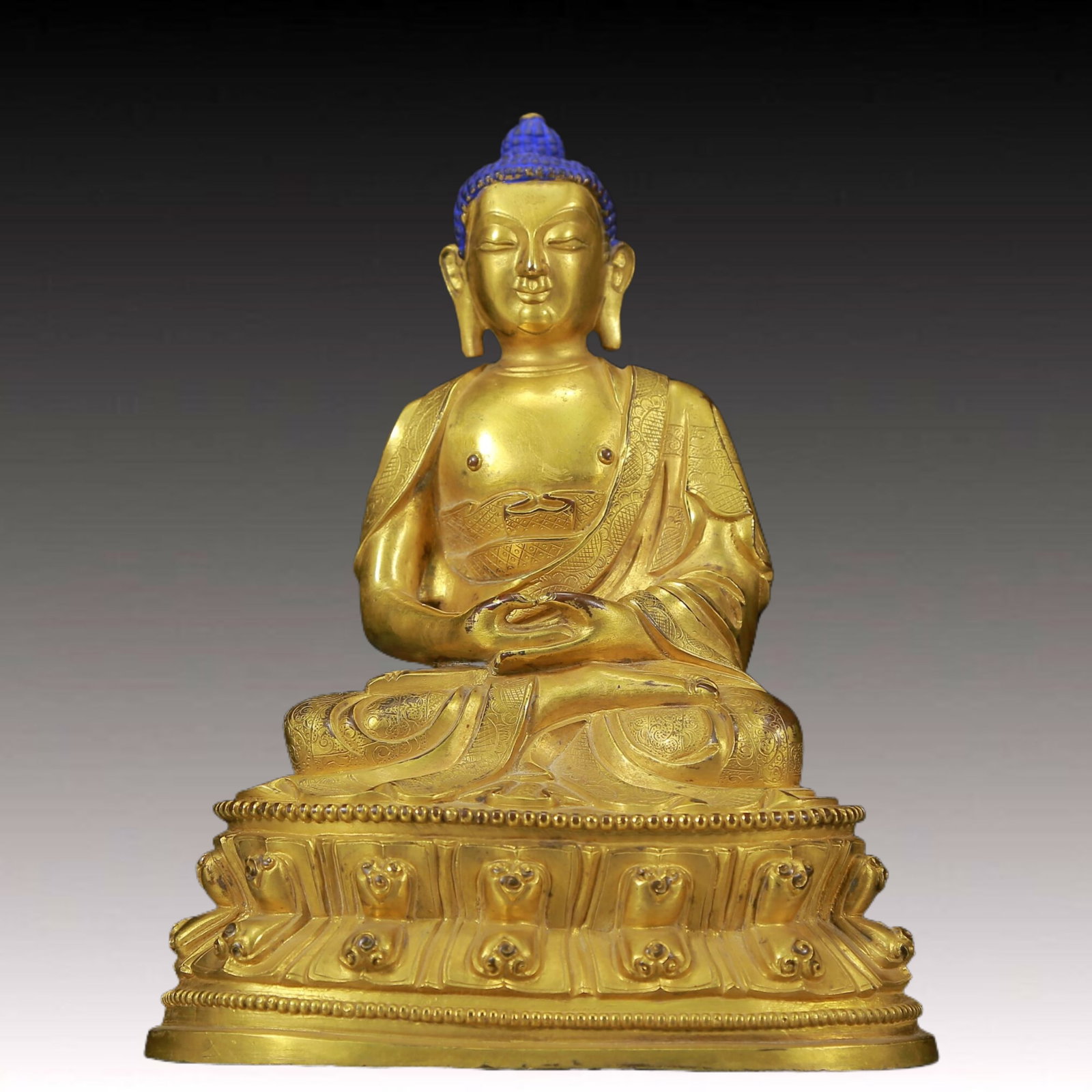 A Solemn Gilt Bronze Statue of Sakyamuni: A Solemn Gilt Bronze Statue of Sakyamuni ,Ming Dynasty, China,Size: 5.7inx4.3inx7.5in,Weight:1750g 铜鎏金释迦摩尼像，明代