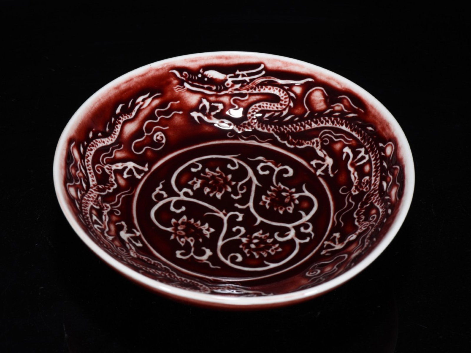 An Exquisite Ji Red Glazed Lotus and Dragon Pattern Plate: An Exquisite Ji Red Glazed Lotus and Dragon Pattern Plate 霁红釉缠枝莲龙纹盘,中国明代