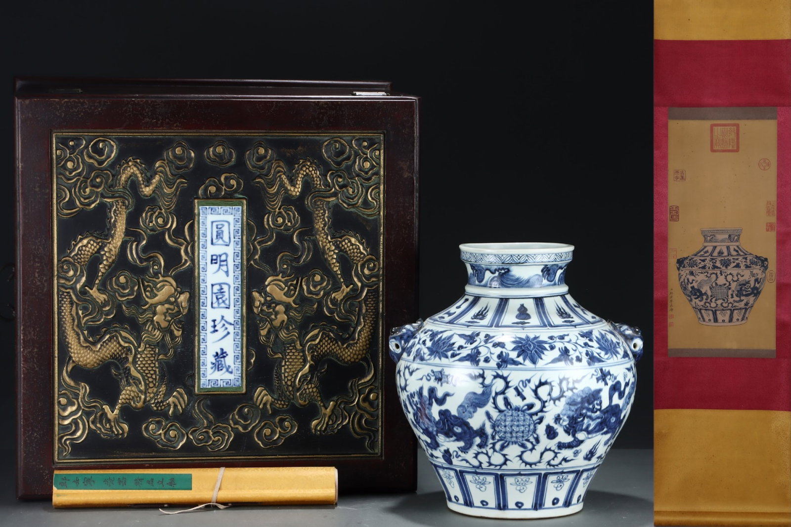 A Rare Blue and White Lotus and Lion Pattern Beast-Ears Jar,with Chinese Vertical Scroll Ink: A Rare Blue and White Lotus and Lion Pattern Beast-Ears Jar,with Chinese Vertical Scroll Ink Painting on Silk,Yuan Dynasty,China,Size:(Without Frame)24inx11.4in,(Porcelain)14.2inx13.4in 青഑
