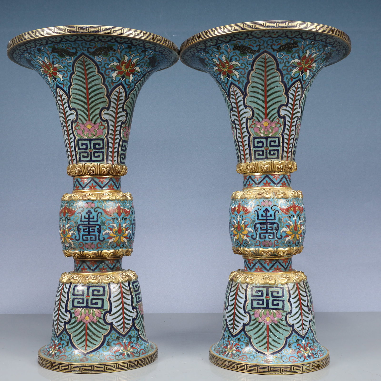 A Pair of Exquisite Cloisonne Lotus and Beast-Face Pattern Vases: A Pair of Exquisite Cloisonne Lotus and Beast-Face Pattern Vases,Qing Dynasty, China,Qianlong Four-character Mark,Size:5.9inx11in,Weight:1700g 一对景泰蓝缠枝&