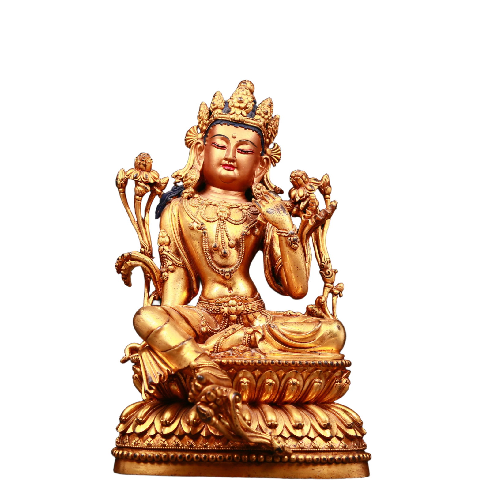 An exquisite gilt bronze statue of green Tara: An exquisite gilt-bronze green Tara statue ,Qing Dynasty, China. Tara has an elegant posture with a peaceful and compassionate expression. Her face is soft and solemn, and her eyes are warm. She seems