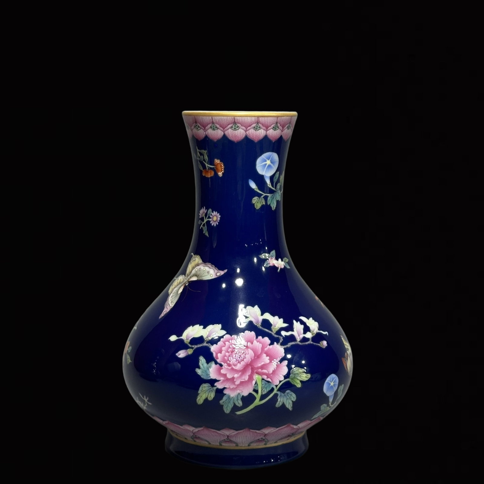 An Exquisite Sapphire Blue Glazed Flower and Butterfly Pattern Vase: An Exquisite Sapphire Blue Glazed Flower and Butterfly Pattern Vase,Qing Dynasty,China,Yongzheng Six-Character Mark,Size:7.7inx5.5in 宝石蓝釉花卉蝴蝶