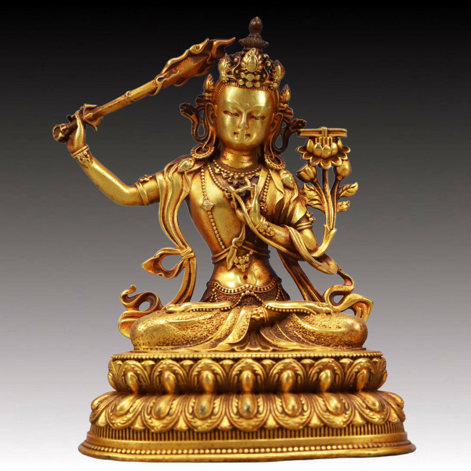 A Solemn Gilt Bronze Statue of Manjusri: A Solemn Gilt Bronze Statue of Manjusri,Qing Dynasty, China,Size:3.1inx2.2inx3.9in,Weight:576g 铜鎏金文殊菩萨像,中国清代