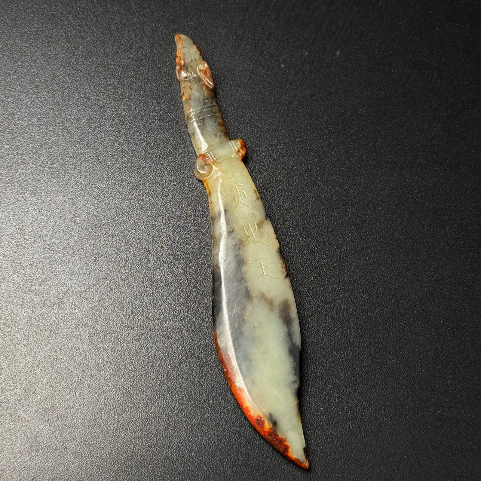 An Exquisite White Jade Sword: An Exquisite White Jade Sword,Qing Dynasty,China,Size:138mmx24mmx5.5mm,Weight:30g 白玉刀,中国清代