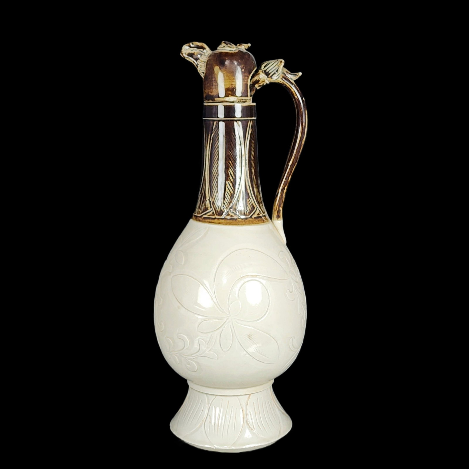 A Rare Ding yao Flower Pattern Pot: A Rare Ding yao Flower Pattern Pot,Song Dynasty,China,Size:12.7inx4.9in 定窑花卉纹壶,中国宋代