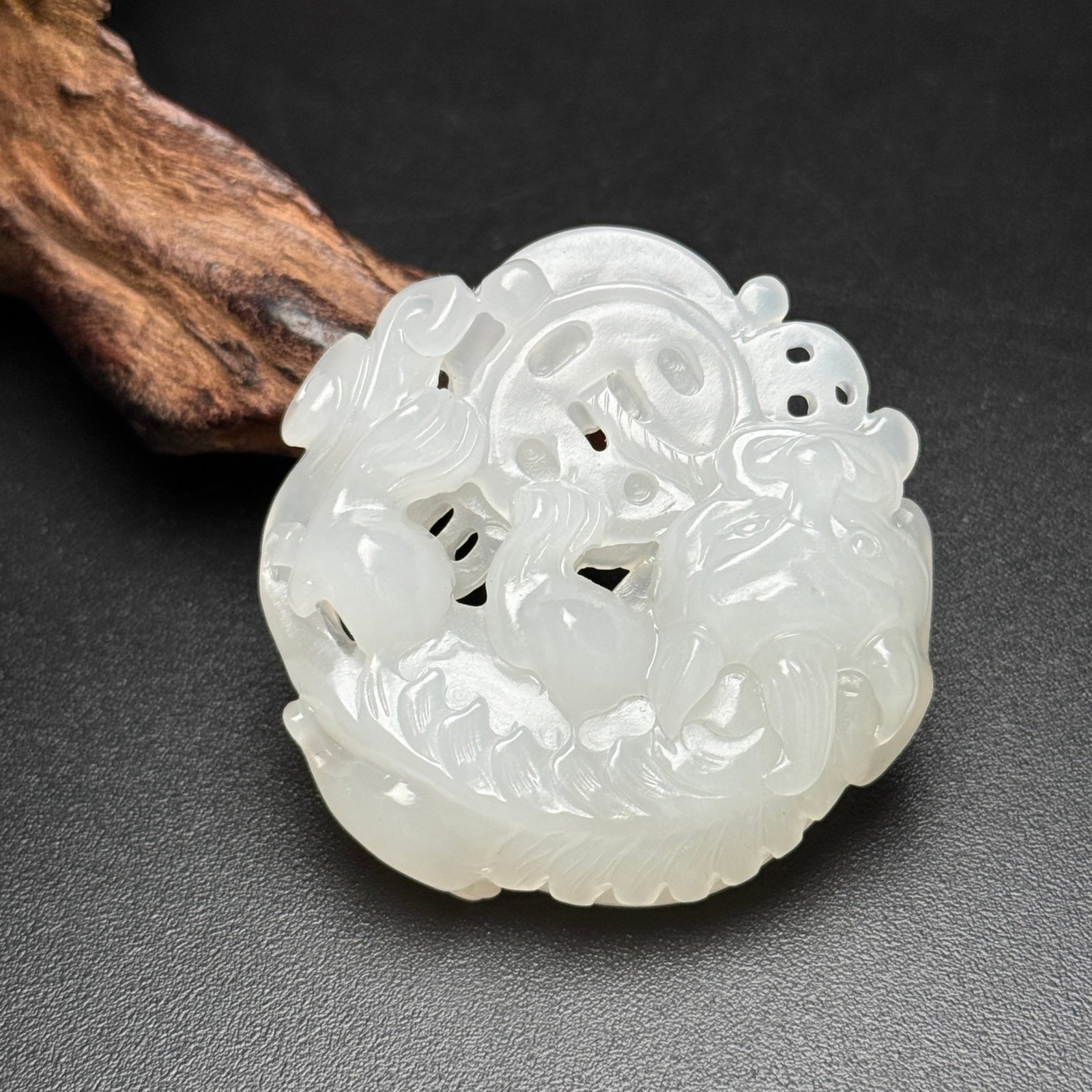 An Exquisite White Jade Auspicious Beast Pattern Pendant: An Exquisite White Jade Auspicious Beast Pattern Pendant,Qing Dynasty,China,Size:46mmx47mmx12mm,Weight:32g 白玉瑞兽纹佩,中国清代