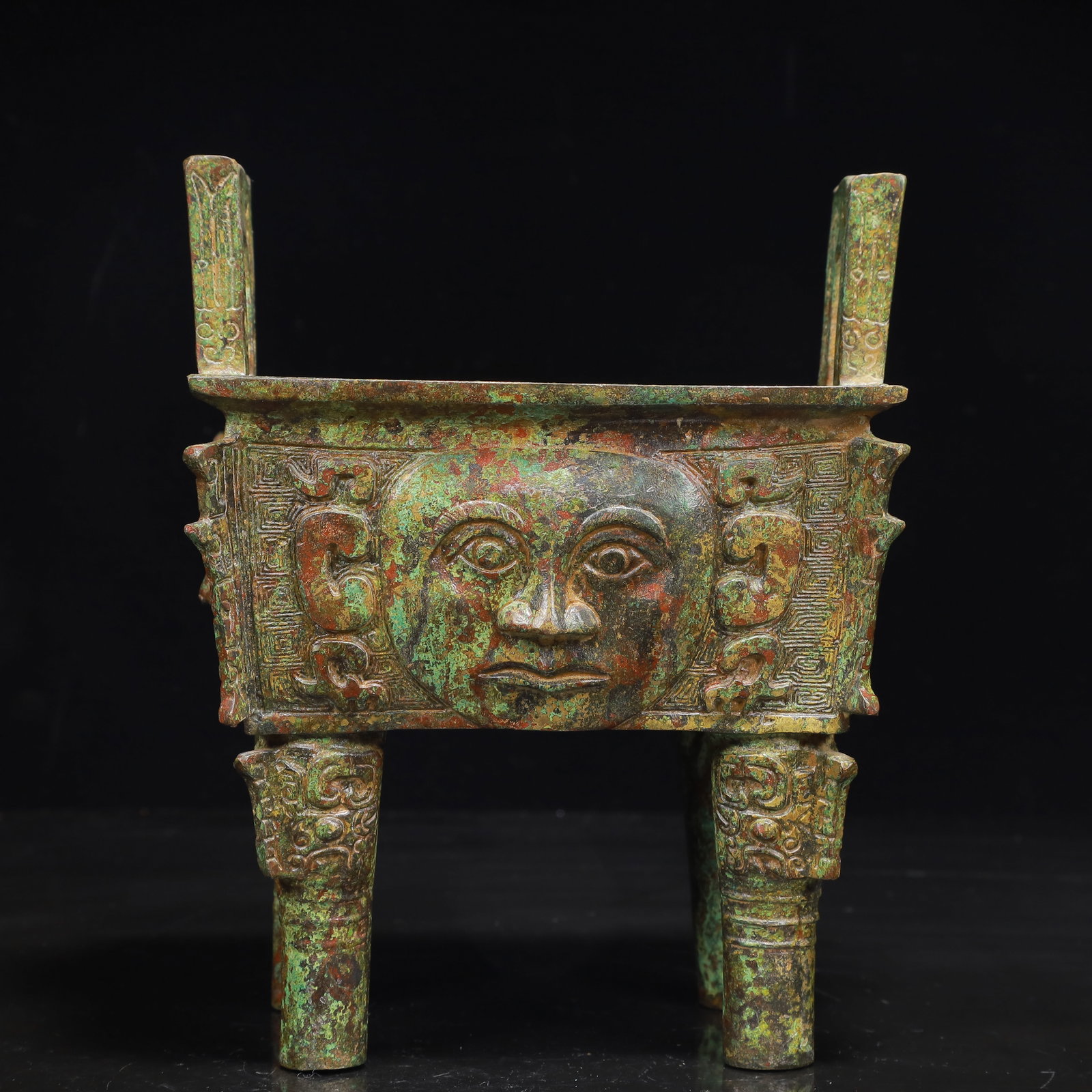 An Archaic Bronze Figure-Face Pattern Censer,with Inscription: An Archaic Bronze Figure-Face Pattern Censer,with Inscription,the Warring States Period in China,Size:6.3inx4.7inx8.3in,Weight:1950g 青铜人面纹香炉,带&#