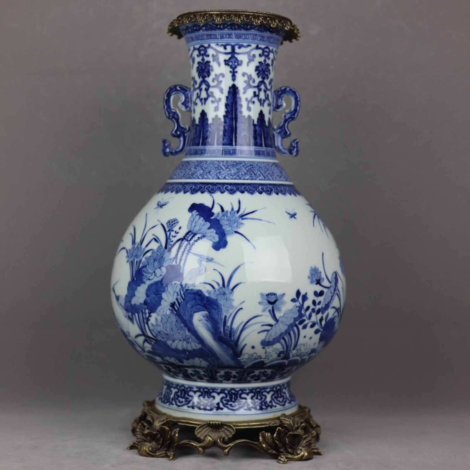 A Huge Blue and White Inlaid Bronze Flower and Bird Pattern Double-Ears Vase: A Huge Blue and White Inlaid Bronze Flower and Bird Pattern Double-Ears Vase,Qing Dynasty,China,Qianlong Six-Character Mark,Size:19.7inx10.6in 青花嵌铜花鸟纹&
