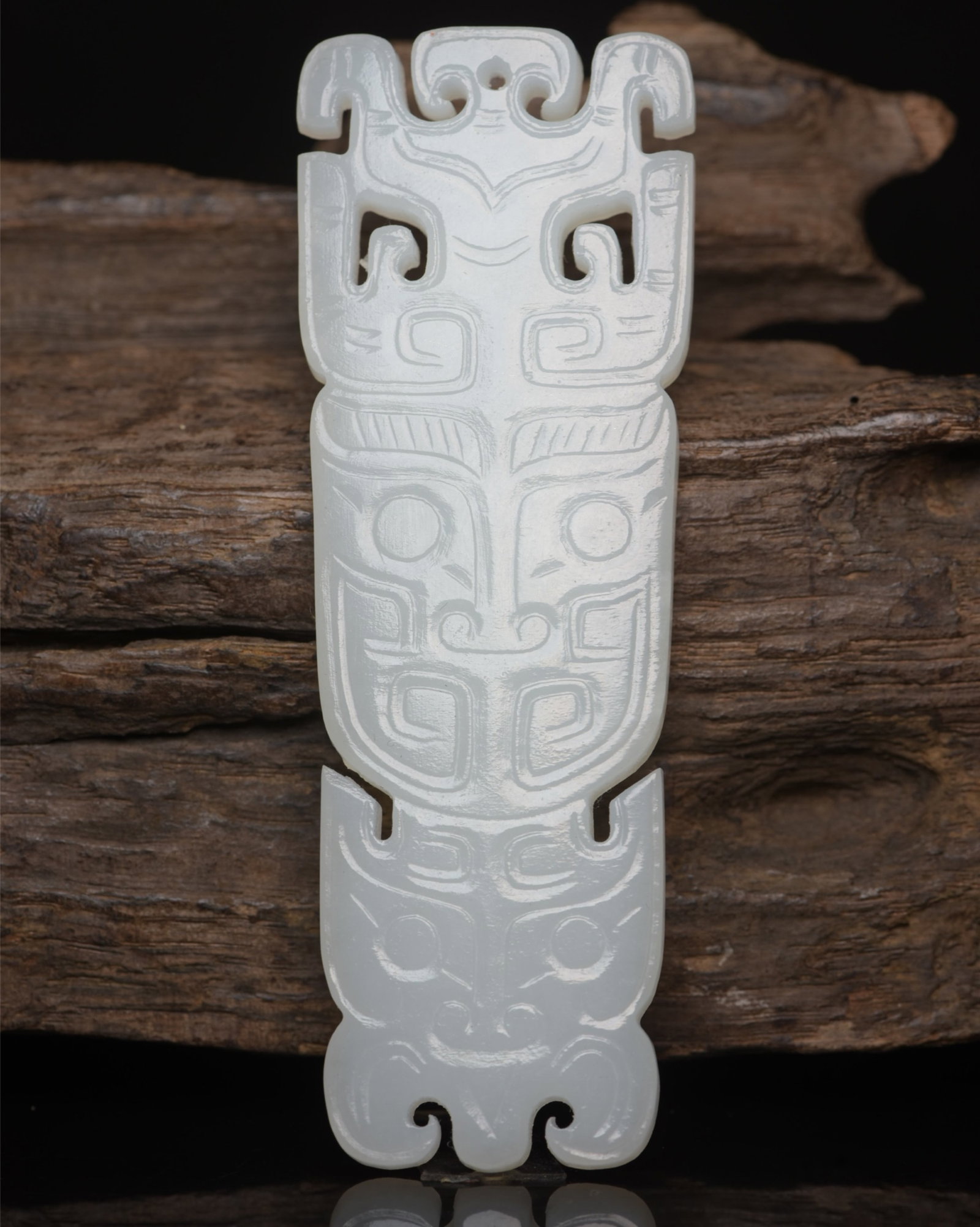 An Exquisite White Jade Beast-Face Pattern Pendant: An Exquisite White Jade Beast-Face Pattern Pendant,Qing Dynasty,China,Size:3.8inx1.3inx0.2in,Weight:39g 白玉兽面纹牌,中国清代