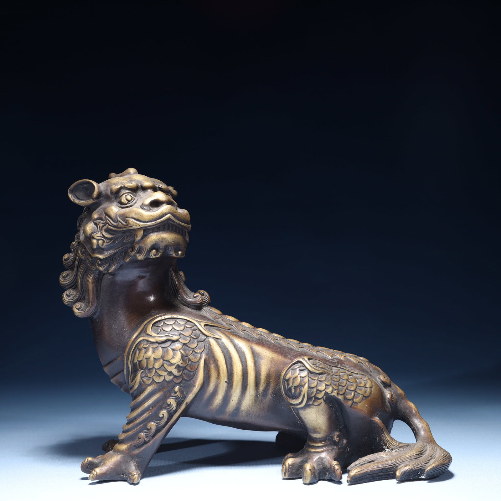 An Exquisite Bronze Auspicious Beast Ornament: An Exquisite Bronze Auspicious Beast Ornament,Qing Dynasty,China,Size:7.9inx3.9inx7.1in,Weight:1450g 铜瑞兽摆件,中国清代