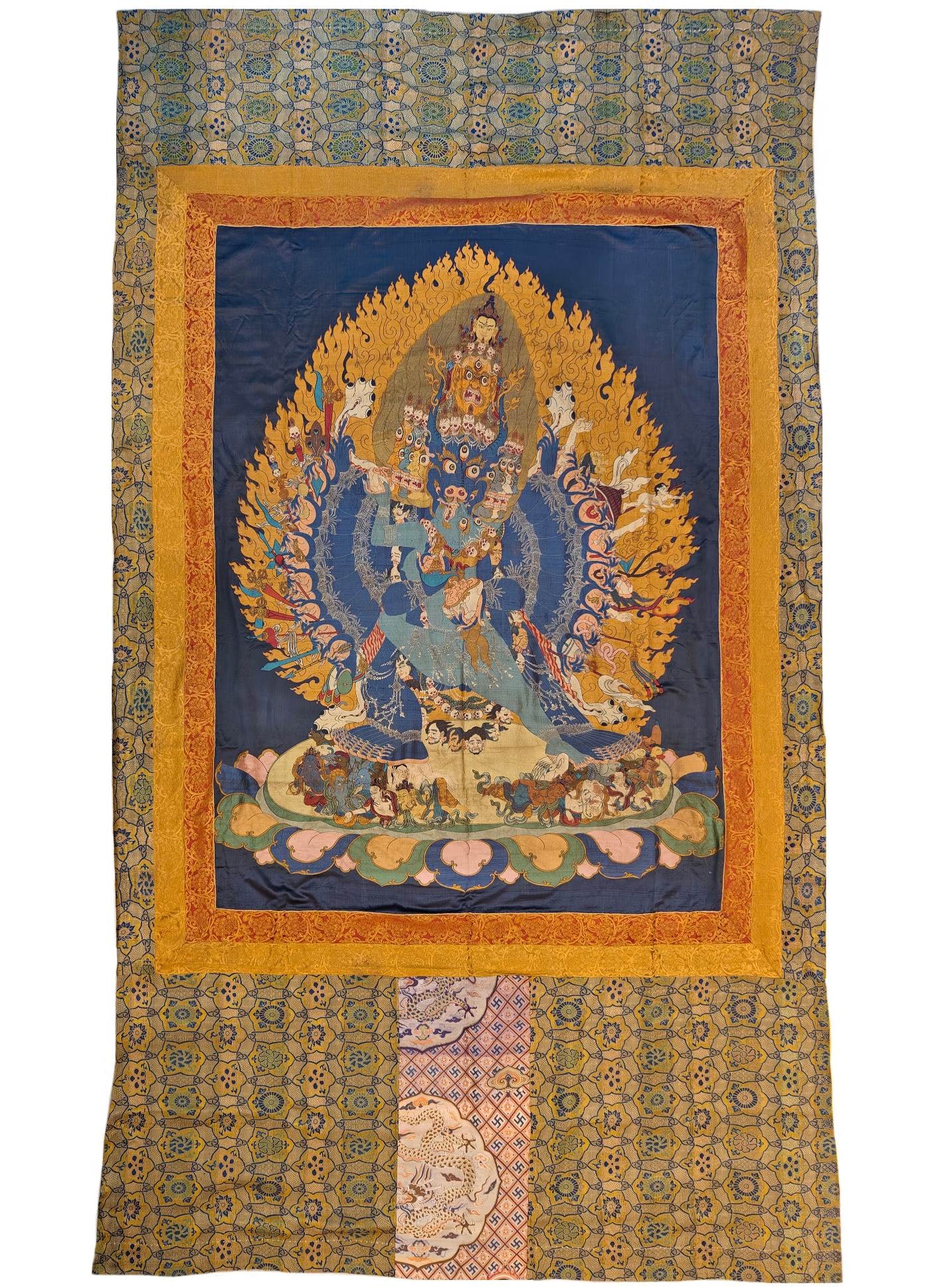 An exquisite brocade thangka of Yamantaka image: An exquisite brocaded Yamantaka Thangka, Qing Dynasty, China, making an exquisite brocade work required multiple complex processes, including design, weaving, sizing, cutting, etc. Craftsmen need