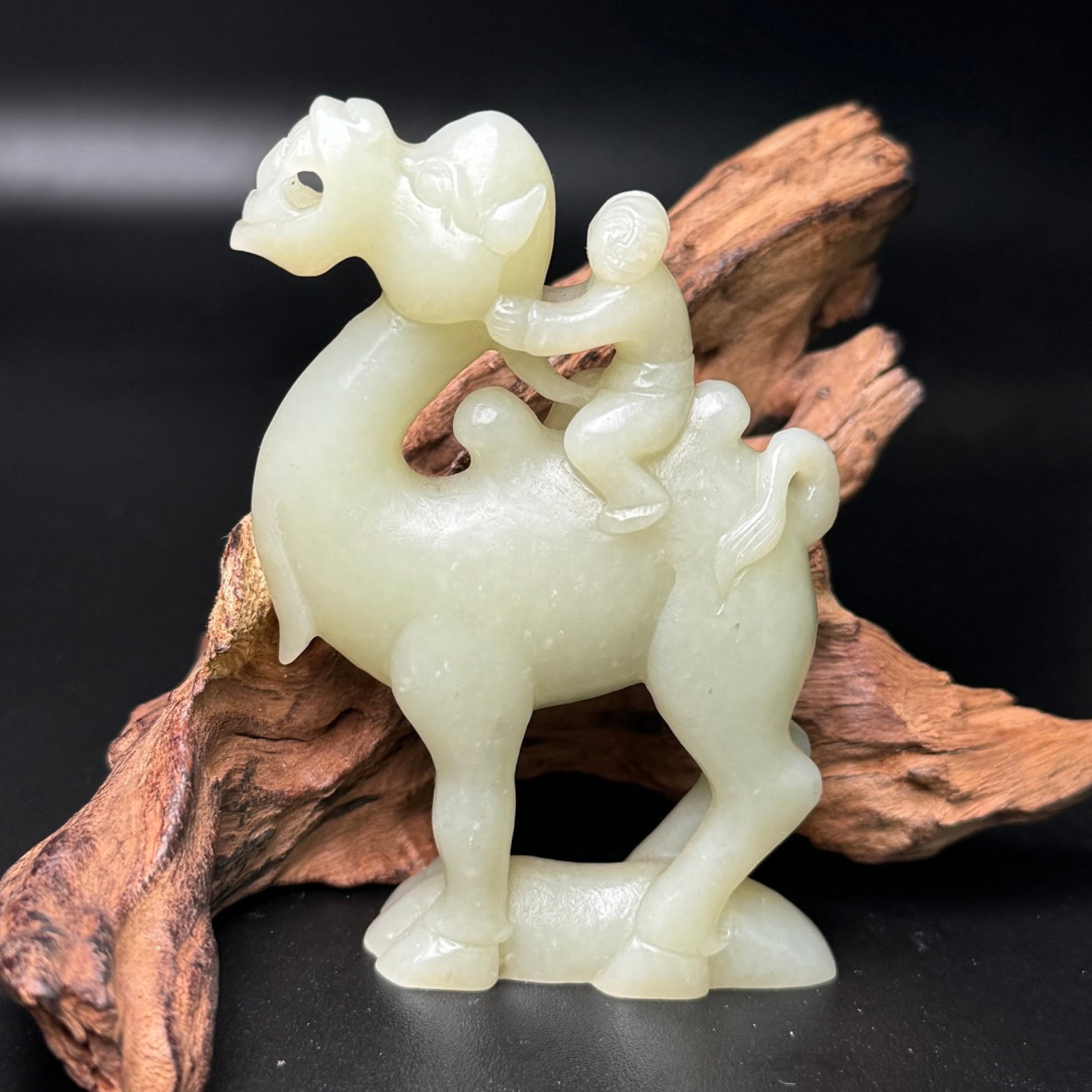 An Exquisite White Jade Figure Riding Camel Ornament: An Exquisite White Jade Figure Riding Camel Ornament,Tang Dynasty,China,Size:62mmx89mmx20mm,Weight:118g 白玉人物骑骆驼摆件,中国唐