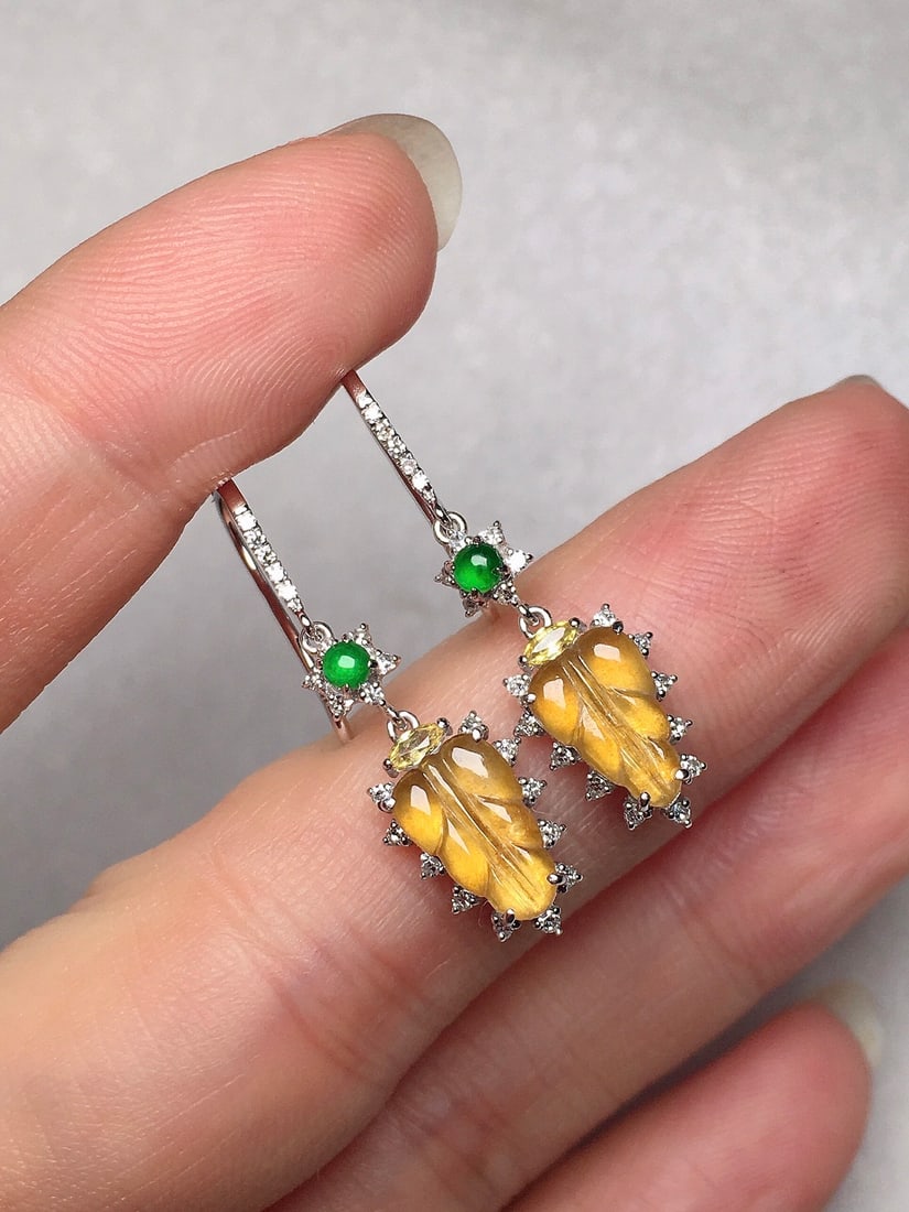 A Pair of Exquisite 18k Gold Diamond Inlaid Jadeite Earrings: A Pair of Exquisite 18k Gold Diamond Inlaid Jadeite Earrings,Size(Loose Stone):9mmx5.8mm 一对18k金钻镶嵌翡翠耳环