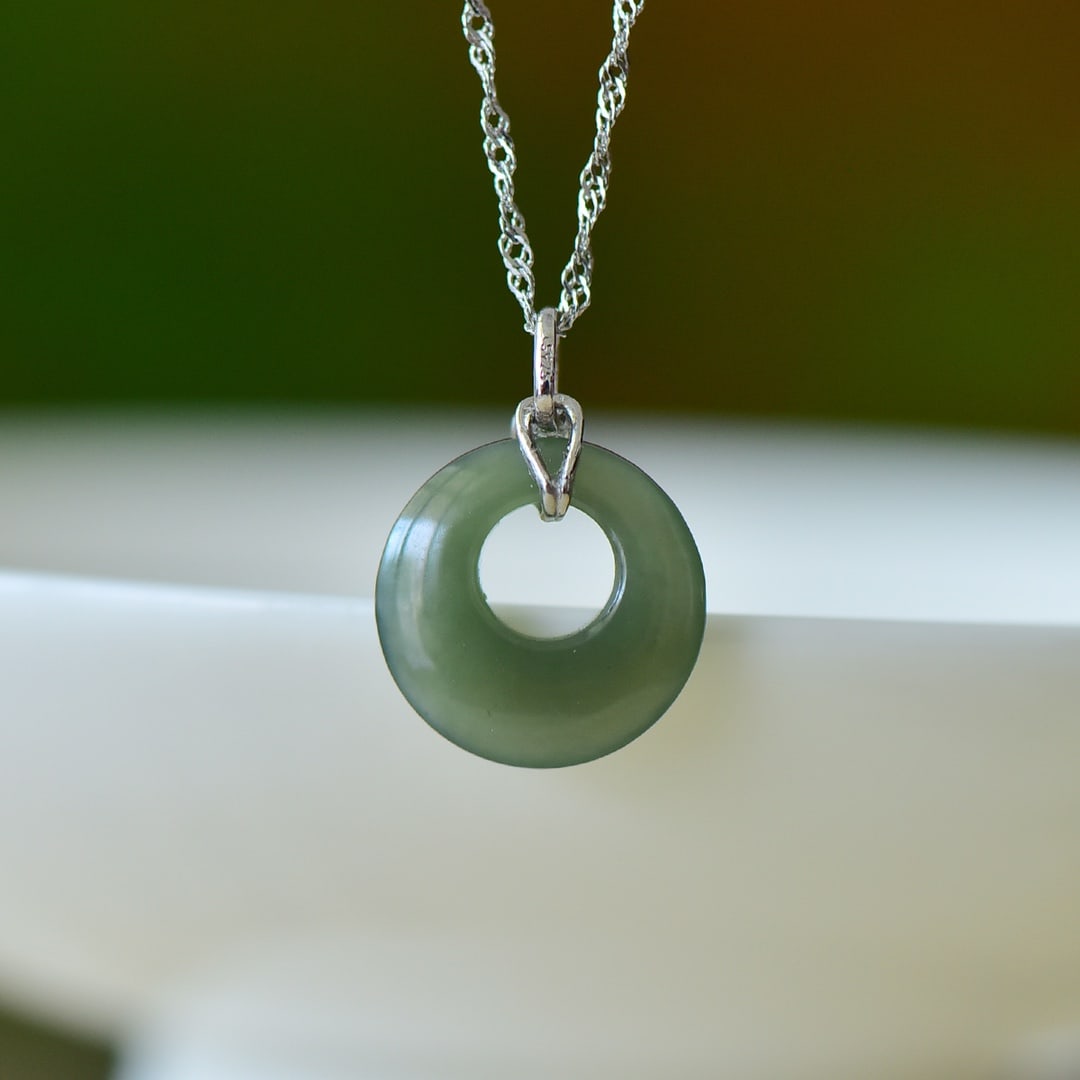 An Exquisite Sterling Silver Inlaid Greenish Jade Pendant: An Exquisite Sterling Silver Inlaid Greenish Jade Pendant,Size:15mmx15mm 纯银镶青玉吊坠