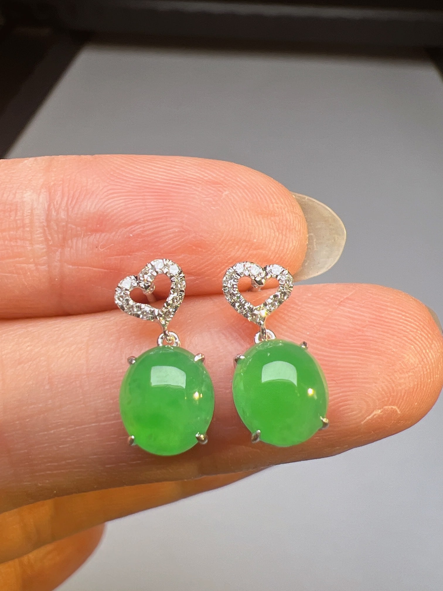 A Pair of Exquisite 18k Gold Diamond Inlaid Jadeite Earrings: A Pair of Exquisite 18k Gold Diamond Inlaid Jadeite Earrings,Size(Loose Stone):7.6mmx6.8mm 一对18k金钻镶嵌翡翠耳环