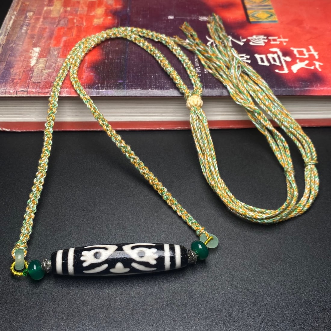 An Exquisite Dzi Bead Pendant: An Exquisite Dzi Bead Pendant,Size:56mmx12mm,Weight:21.7g 天珠挂件