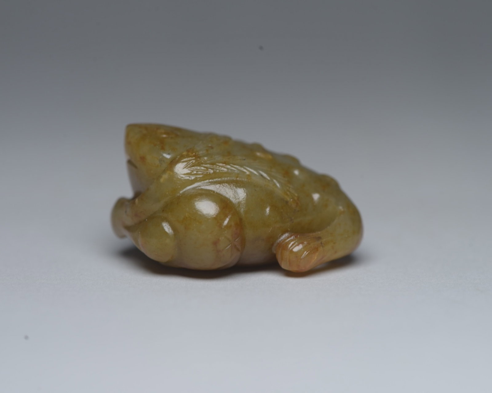 An Exquisite Yellow Jade Golden Toad Ornament: An Exquisite Yellow Jade Golden Toad Ornament,Qing Dynasty,China,Size:1.4inx1.1inx0.7in,Weight:26g 黄玉金蟾摆件,中国清代