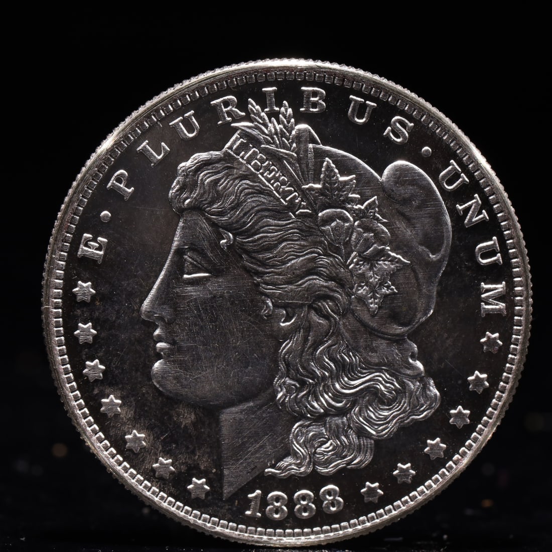 USA Morgan Dollar 1888 Coin: Obv: profile bust with date below and E PLURIBUS UNUM legend and stars around. Rev: eagle with In God we trust above within wreath with UNITED STATES OF AMERICA ONE DOLLAR legend. IN GOD WE TRUST / LI