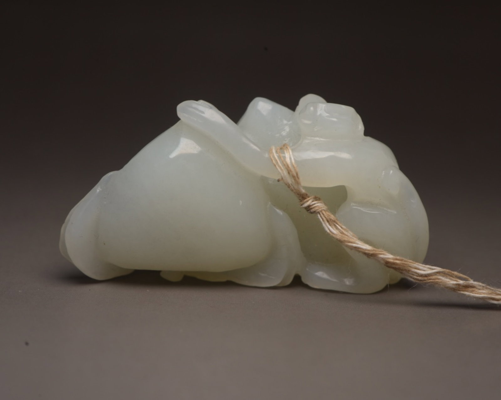 An Exquisite White Jade Monkey Ornament: An Exquisite White Jade Monkey Ornament,Qing Dynasty,China,Size:2.2inx1.1inx0.9in,Weight:44g 白玉猴子摆件,中国清代
