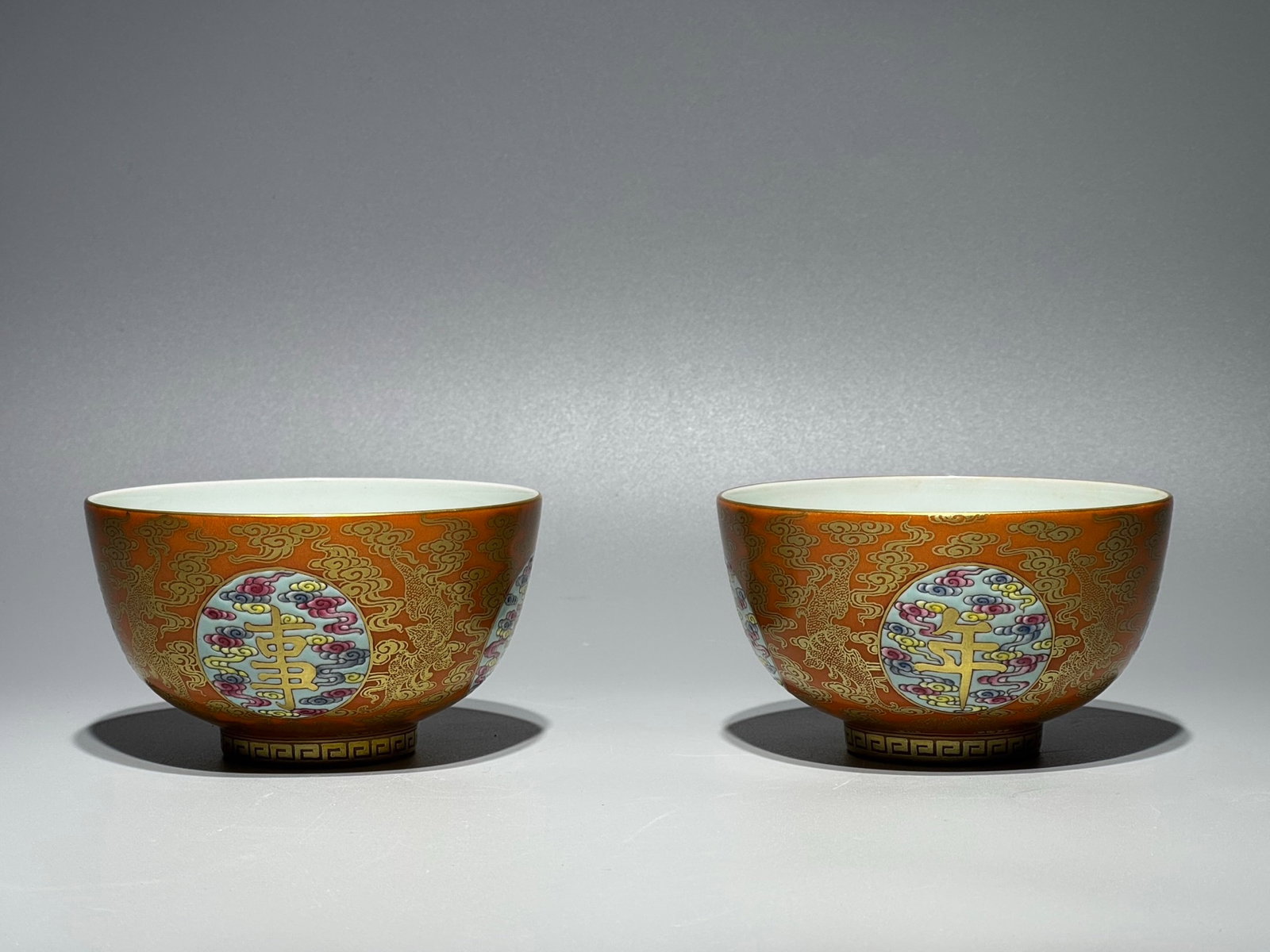 A Pair of Exquisite Famille-Rose Iron-Red Auspicious Cloud Pattern Bowls: A Pair of Exquisite Famille-Rose Iron-Red Auspicious Cloud Pattern Bowls,Qing Dynasty,China,Yongzheng Four-character Mark,Size:2.4inx4.2in