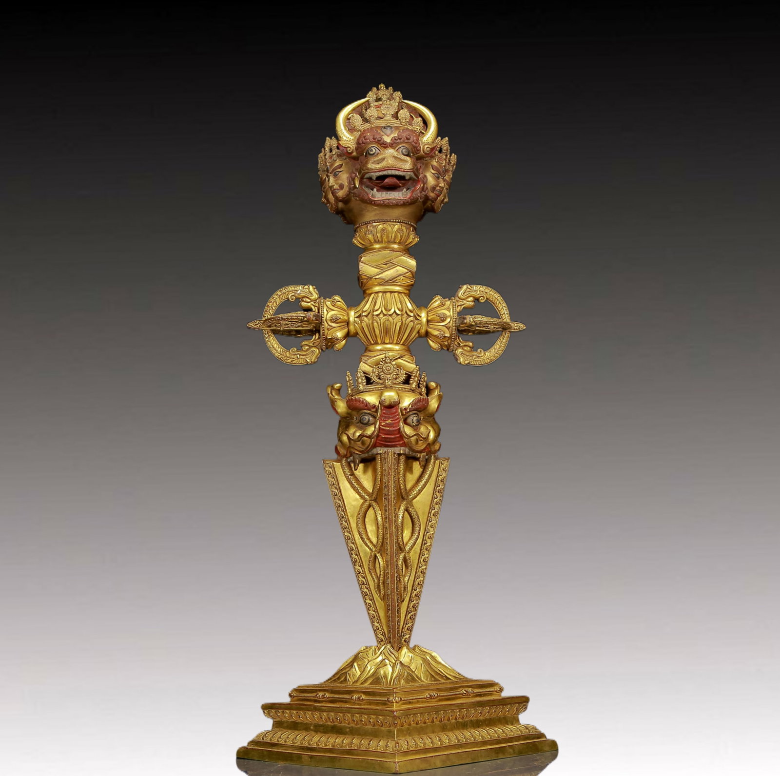 An exquisite gilt copper Vajra of Majesty: An exquisite gilt bronze Mahamighty Vajra pestle Ming Dynasty, China. The majestic image of this gilt bronze Mahamighty Vajra statue is a breathtaking art treasure that demonstrates the superb skills 