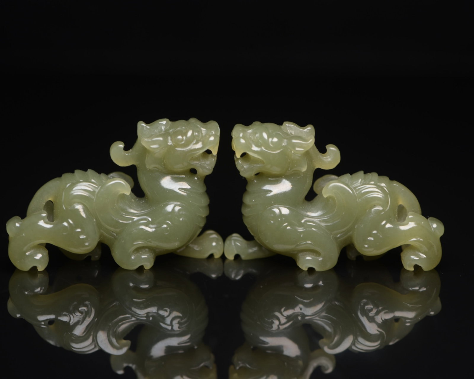 A Pair of Exquisite Yellow Jade Auspicious Beast Ornaments: A Pair of Exquisite Yellow Jade Auspicious Beast Ornaments,Qing Dynasty,China,Size:1.8inx1.2inx0.5in,Weight:43g 一对黄玉瑞兽摆件,中国清
