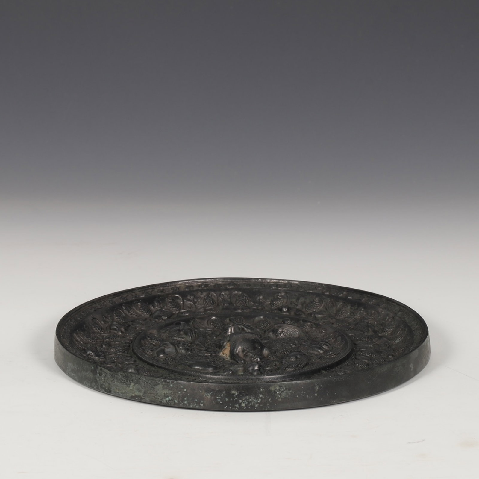 An Exquisite Bronze Seawater and Beast Pattern Mirror: An Exquisite Bronze Seawater and Beast Pattern Mirror,Tang Dynasty,China,Size:0.8inx8.7in 铜花卉兽纹镜子,中国唐代