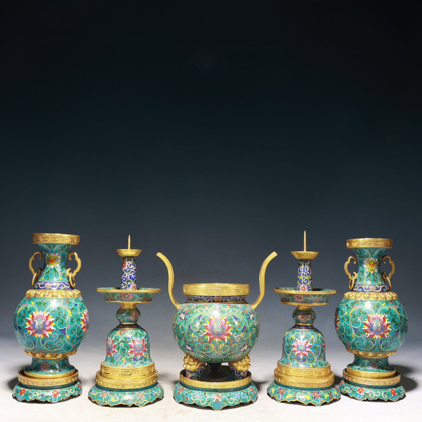 A Set of Fine Cloisonne Lotus Pattern Ornaments: A Set of Fine Cloisonne Lotus Pattern Ornaments,Qing Dynasty, China,Qianlong Four-character Mark,Size:(Censer)7.5inx4.7inx9.1in,(Candlestick)4.3inx10.2in,(Vase)4.3inx9.8in,Weight:12200g 一࣯