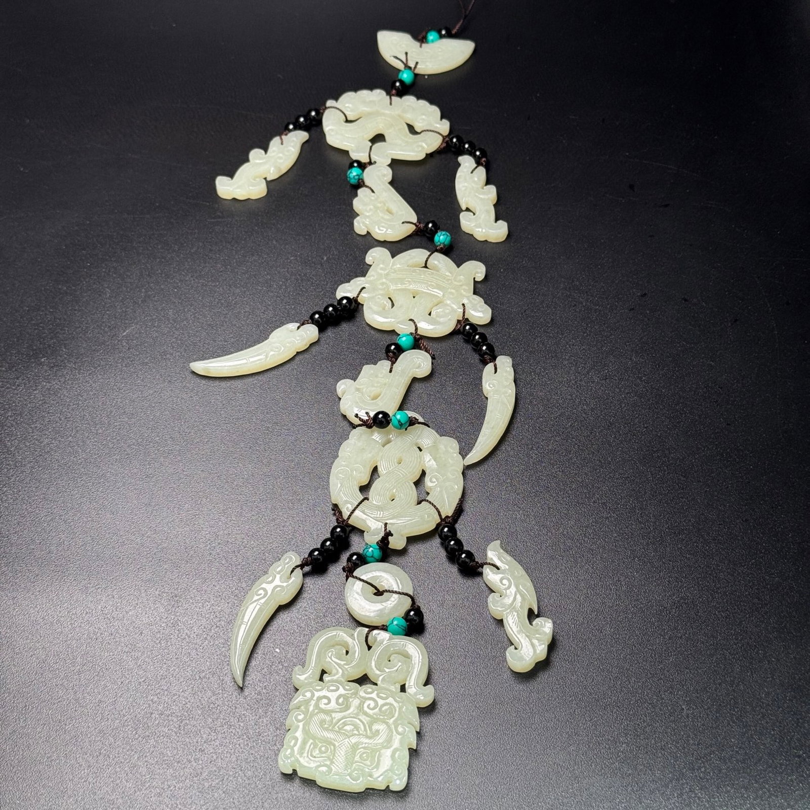 An Exquisite White Jade Beast-Face Pattern Pendant: An Exquisite White Jade Beast-Face Pattern Pendant,Qing Dynasty,China,Size:42.8mmx49mmx5.5mm,Weight:141g 白玉兽面纹挂件,中国清代