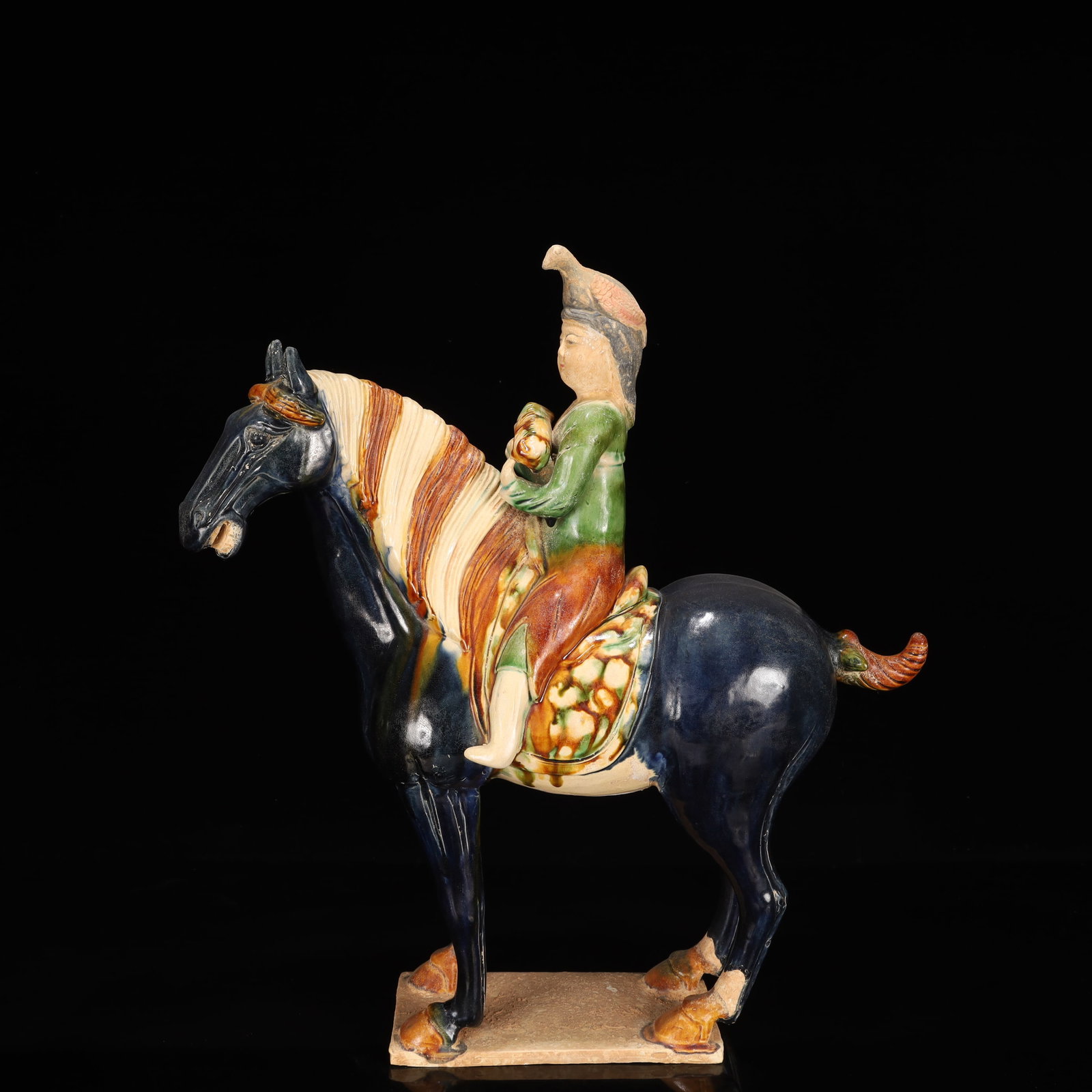 A Rare Tang Tri-Color Glazed Pottery Figure Riding Horse Ornament: A Rare Tang Tri-Color Glazed Pottery Figure Riding Horse Ornament,Tang Dynasty, China,Chinese Tang Tri-colored Pottery, or Tang Sancai, flourished during the Tang Dynasty (618–907 AD). It's