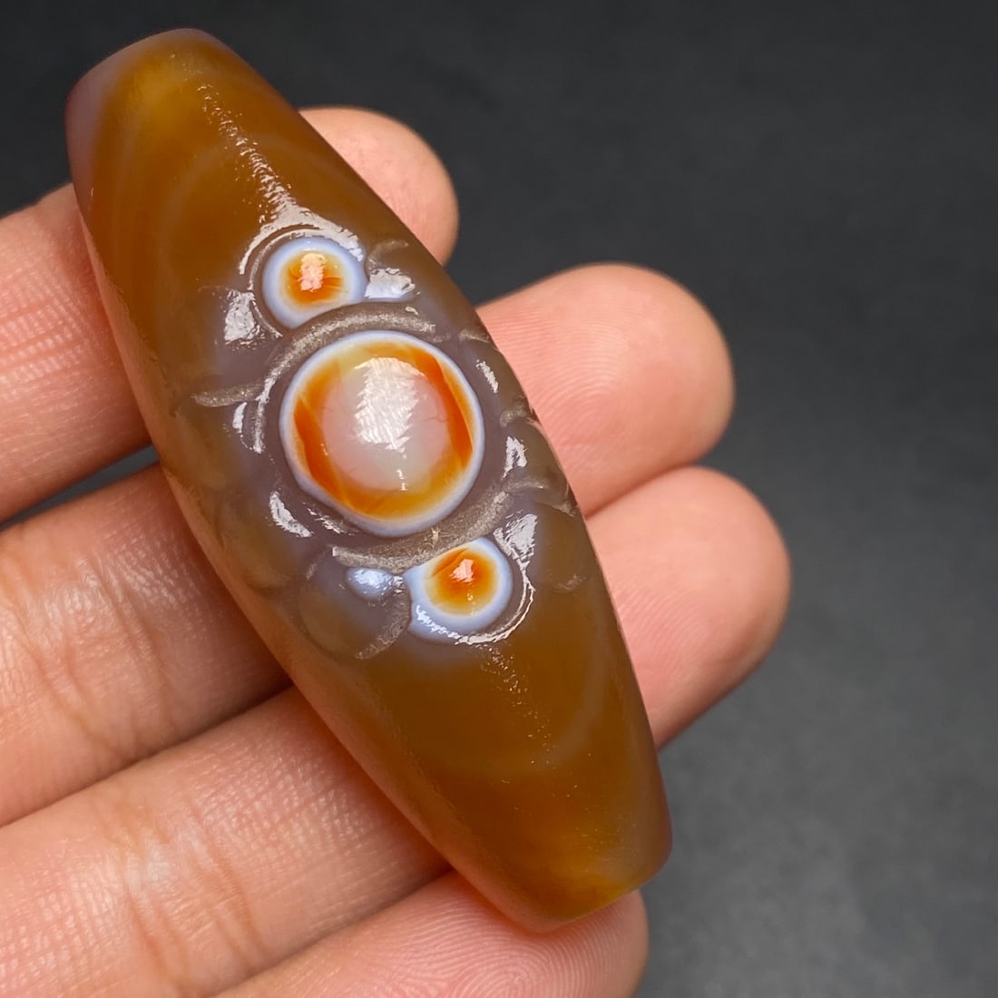 An Exquisite Dzi Bead Pendant: An Exquisite Dzi Bead Pendant,Size:54mmx20mmx19mm,Weight:28g 天珠挂件