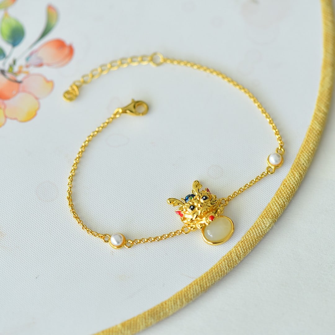 An Exquisite Sterling Silver-Gold Plated Inlaid White Jade Enamel Bracelet: An Exquisite Sterling Silver-Gold Plated Inlaid White Jade Enamel Bracelet,Size:6mmx8mm 纯银镀金镶白玉珐琅手链