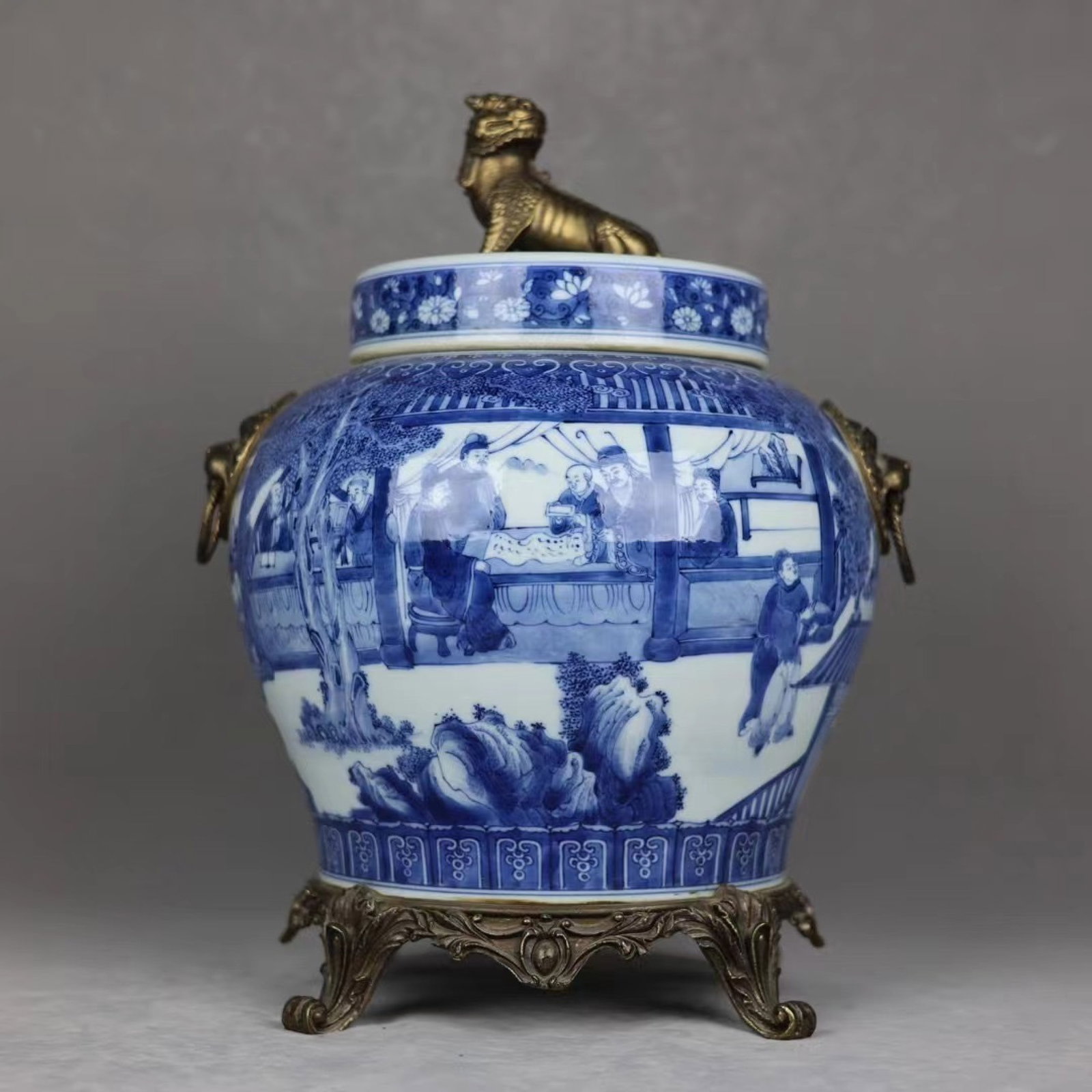 A Huge Blue and White Inlaid Bronze Character and Story Pattern Lion-Ears Jar with Cover: A Huge Blue and White Inlaid Bronze Character and Story Pattern Lion-Ears Jar with Cover,Qing Dynasty,China,Qianlong Six-character Mark,Size:17.3inx12.6in 青花镶铜人Ĥ