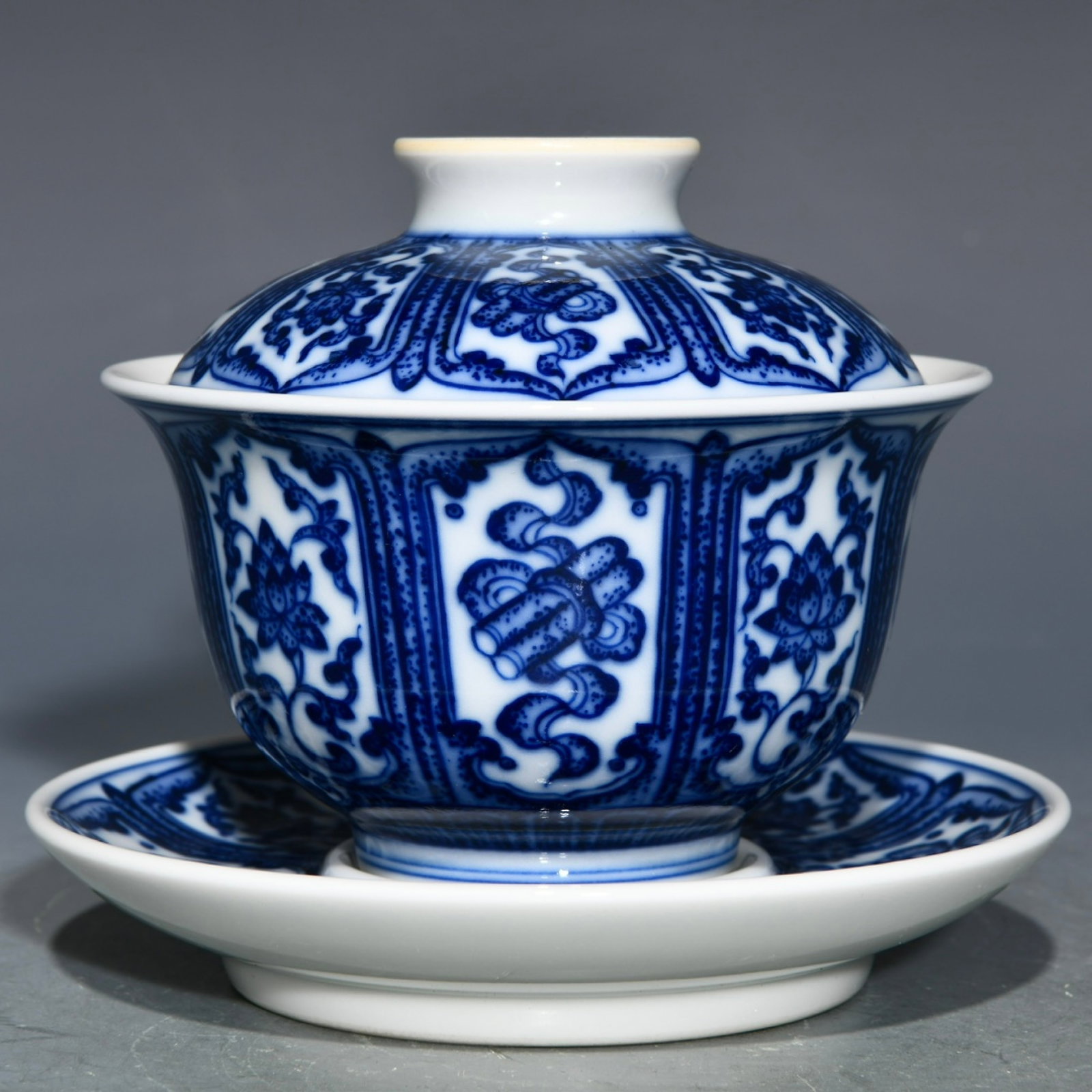 An Exquisite Blue and White Eight Treasures Pattern Bowl with Cover,with Plate: An Exquisite Blue and White Eight Treasures Pattern Bowl with Cover,with Plate,Qing Dynasty,China,Yongzheng Six-character Mark,Size:3.9inx4.6in 青花八宝纹盖碗