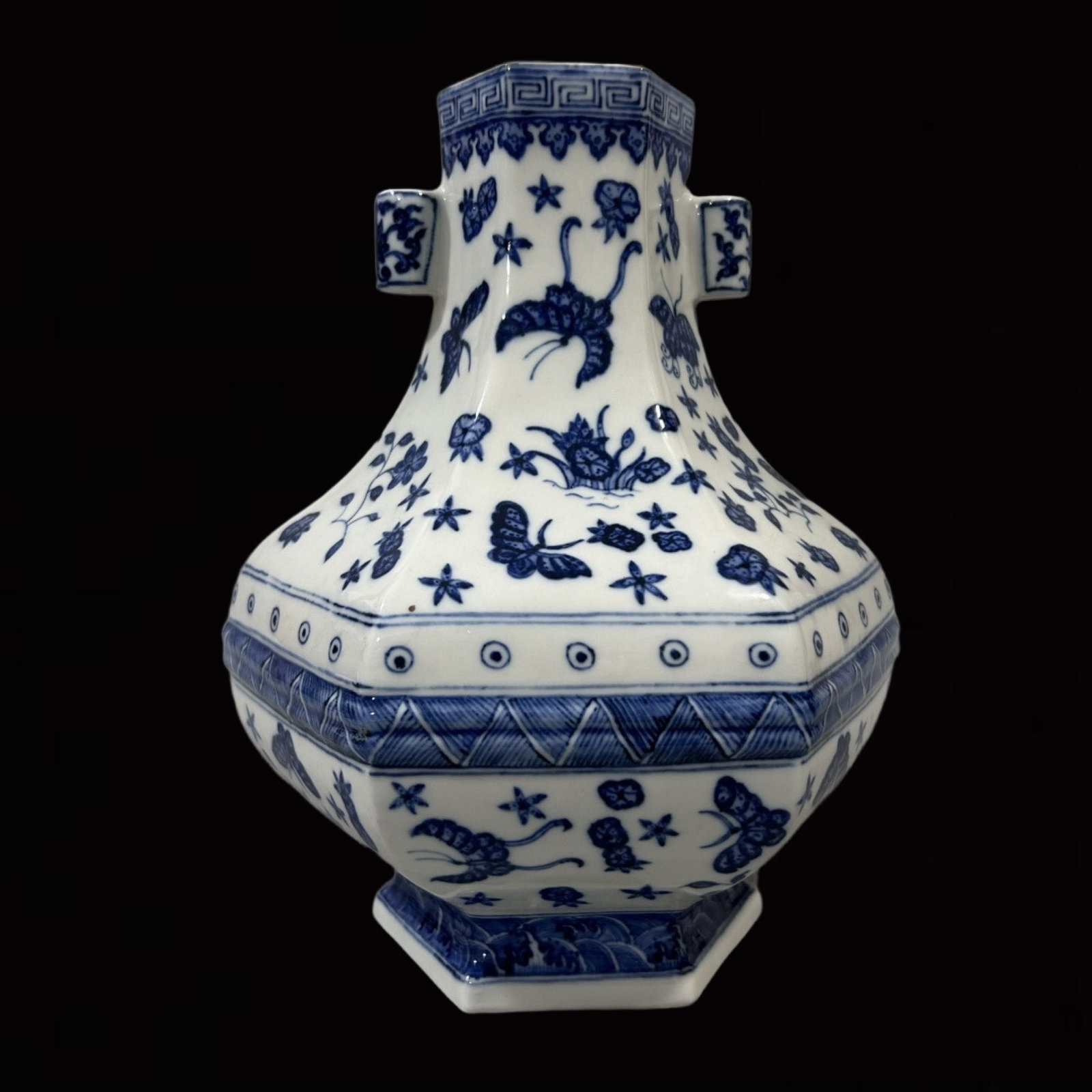 An Exquisite Blue and White Flower and Butterfly Pattern Double-Ears Vase: An Exquisite Blue and White Flower and Butterfly Pattern Double-Ears Vase,Qing Dynasty,China,Qianlong Six-character Mark,Size:7.1inx10.4in 青花花卉蝴蝶纹Ö