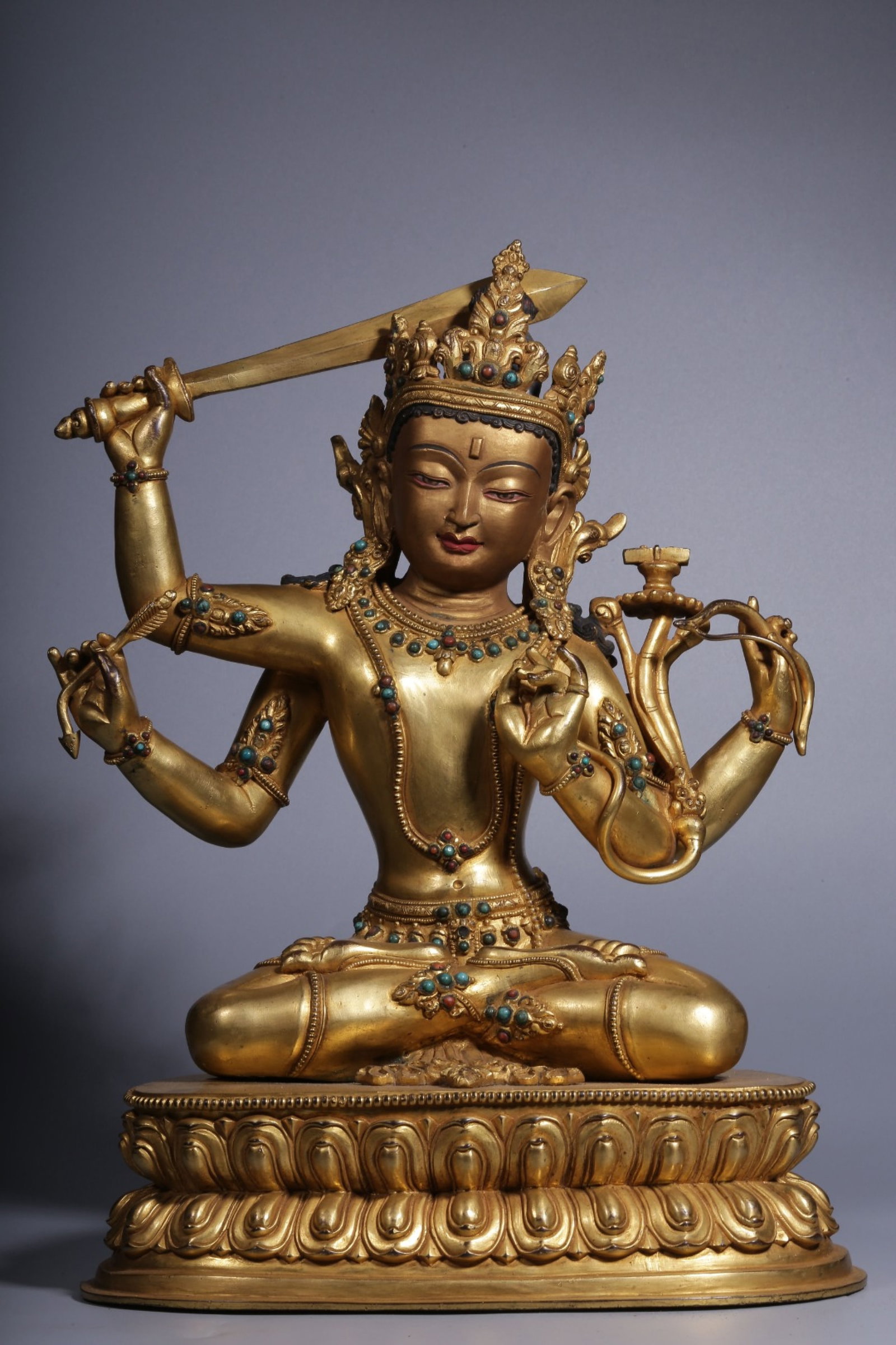 A Rare Gilt Bronze Inlaid Gems Statue of Manjusri: A Rare Gilt Bronze Inlaid Gems Statue of Manjusri,Qing Dynasty, China,Size:14.2inx10inx7.5in,Weight:8250g 铜鎏金嵌宝石文殊菩萨像,È