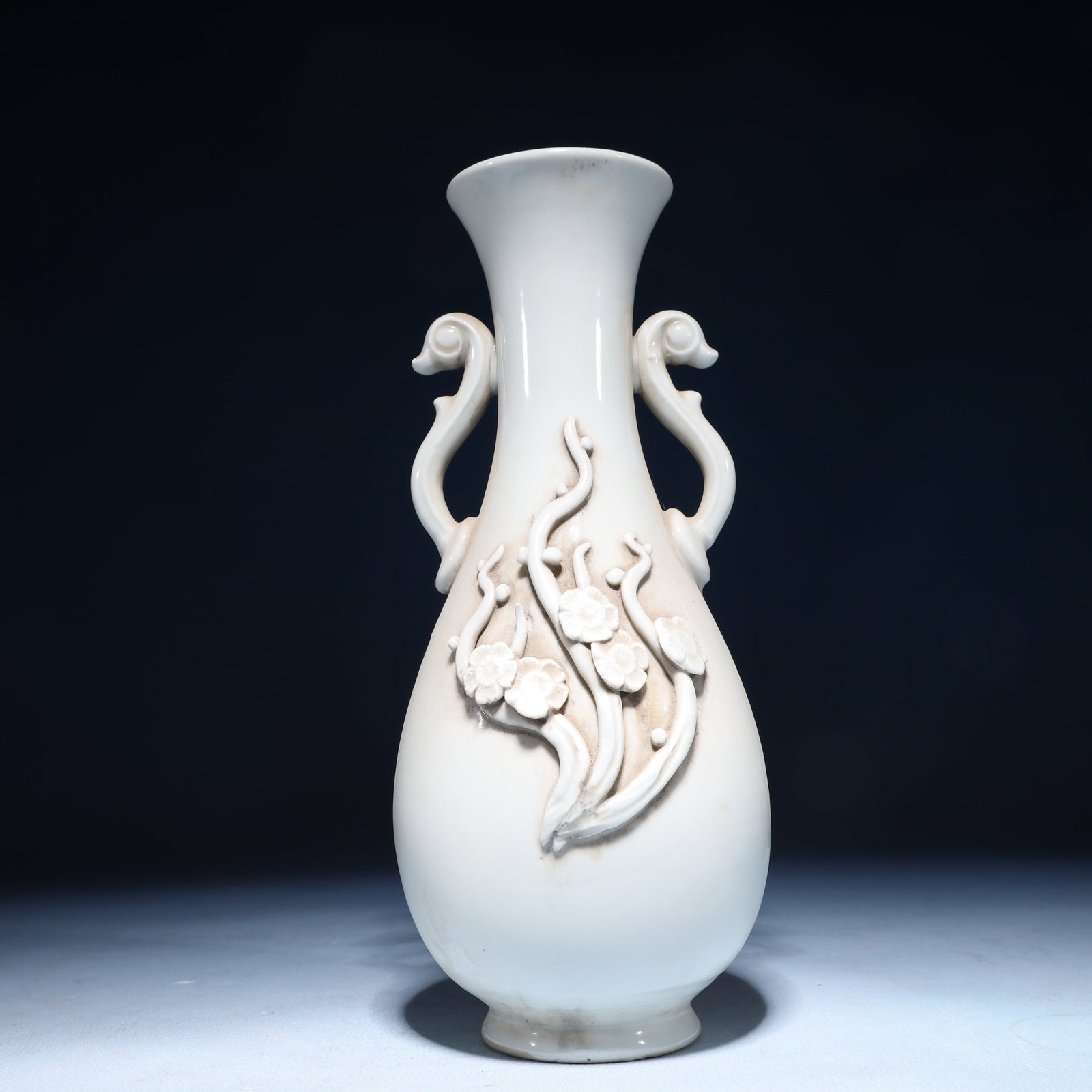 An Exquisite Ding yao Flower Pattern Double-Ears Vase: An Exquisite Ding yao Flower Pattern Double-Ears Vase Ding yao Flower Pattern Double-Ears Vase,Song Dynasty,China,Size:4.5inx10.4in,Weight:1100g 定窑花卉纹双耳