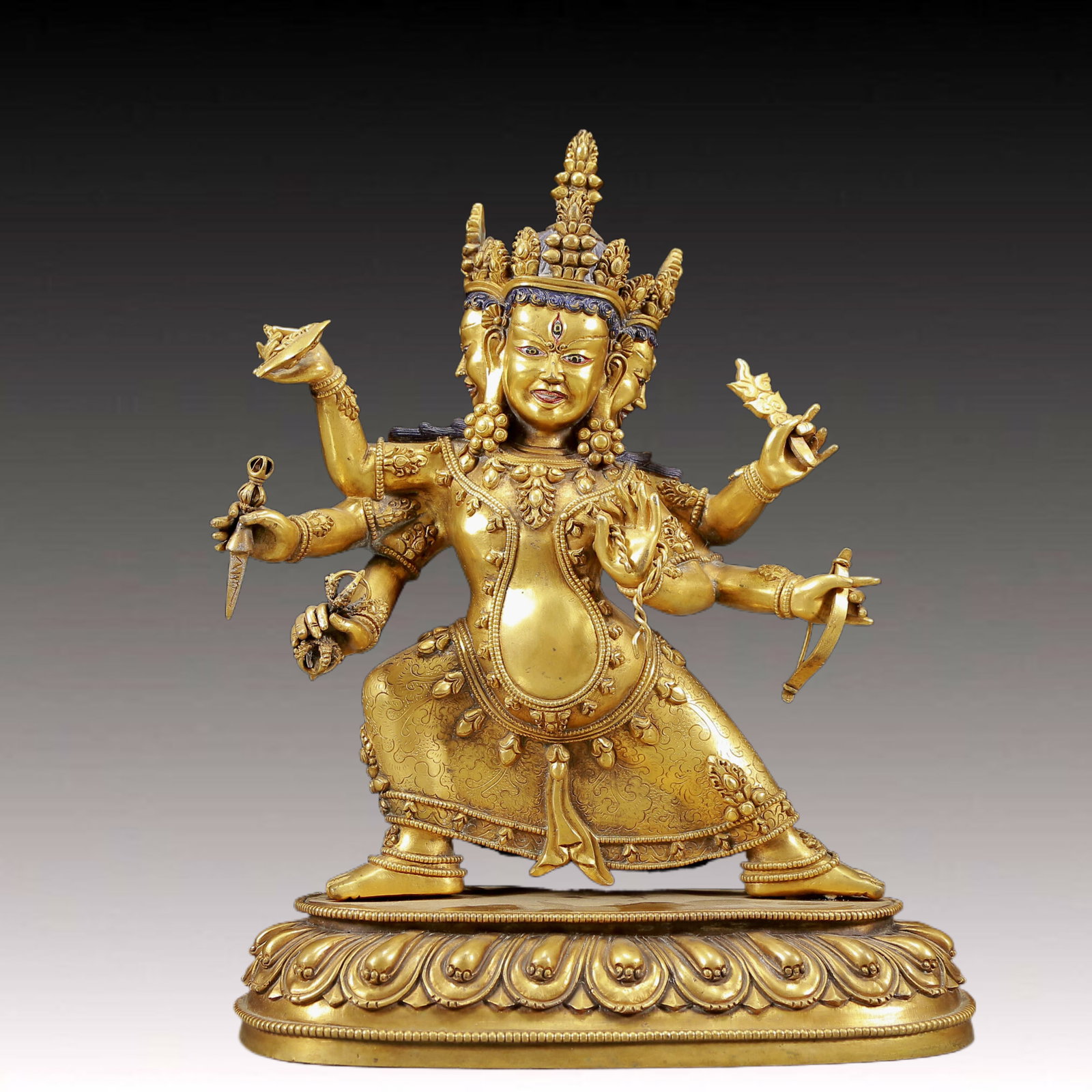A Solemn Gilt Bronze Statue of Three-Headed and Six-Armed Vajra: A Solemn Gilt Bronze Statue of Three-Headed and Six-Armed Vajra,Ming Dynasty, China,Size:10.2inx5.1inx13.4in,Weight:5640g 铜鎏金三头六臂金刚ࠔ